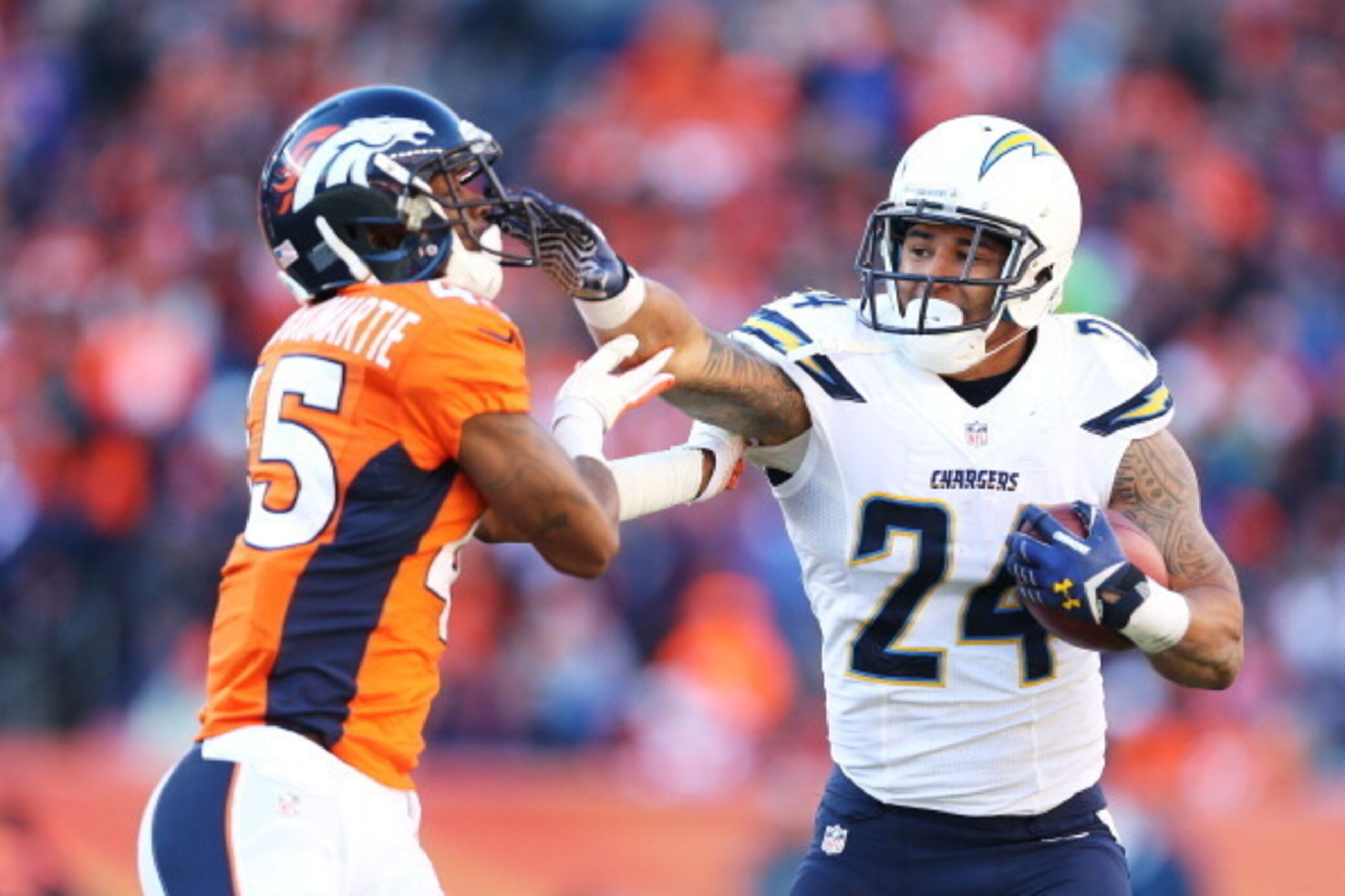 DENVER, CO - JANUARY 12: Ryan Mathews #24 of the San Diego Chargers tries to avoid the tackle of Dominique Rodgers-Cromartie #45 of the Denver Broncos during the AFC Divisional Playoff Game at Sports Authority Field at Mile High on January 12, 2014 in D DENVER, CO - JANUARY 12: Ryan Mathews #24 of the San Diego Chargers tries to avoid the tackle of Dominique Rodgers-Cromartie #45 of the Denver Broncos during the AFC Divisional Playoff Game at Sports Authority Field at Mile High on January 12, 2014 in D