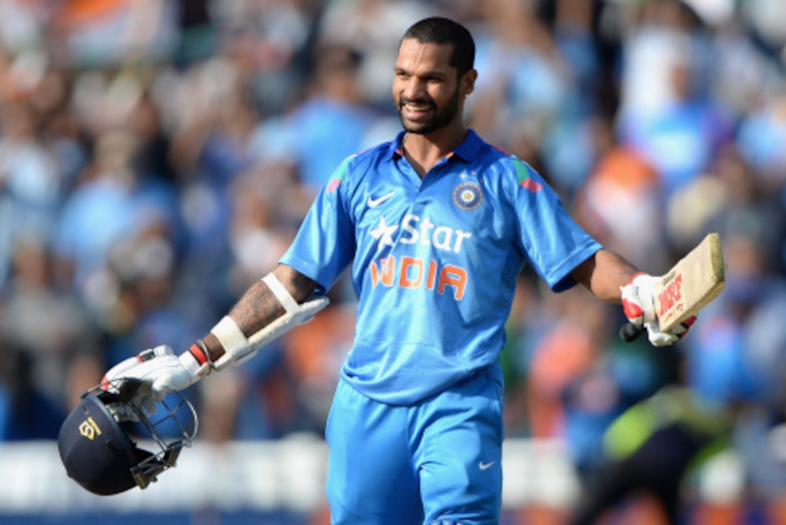 BIRMINGHAM, ENGLAND - SEPTEMBER 02:  Shikhar Dhawan of India celebrates hitting the winning runs during the 4th Royal London One Day International match between England and India at Edgbaston on September 2, 2014 in Birmingham, England.  (Photo by Gareth 