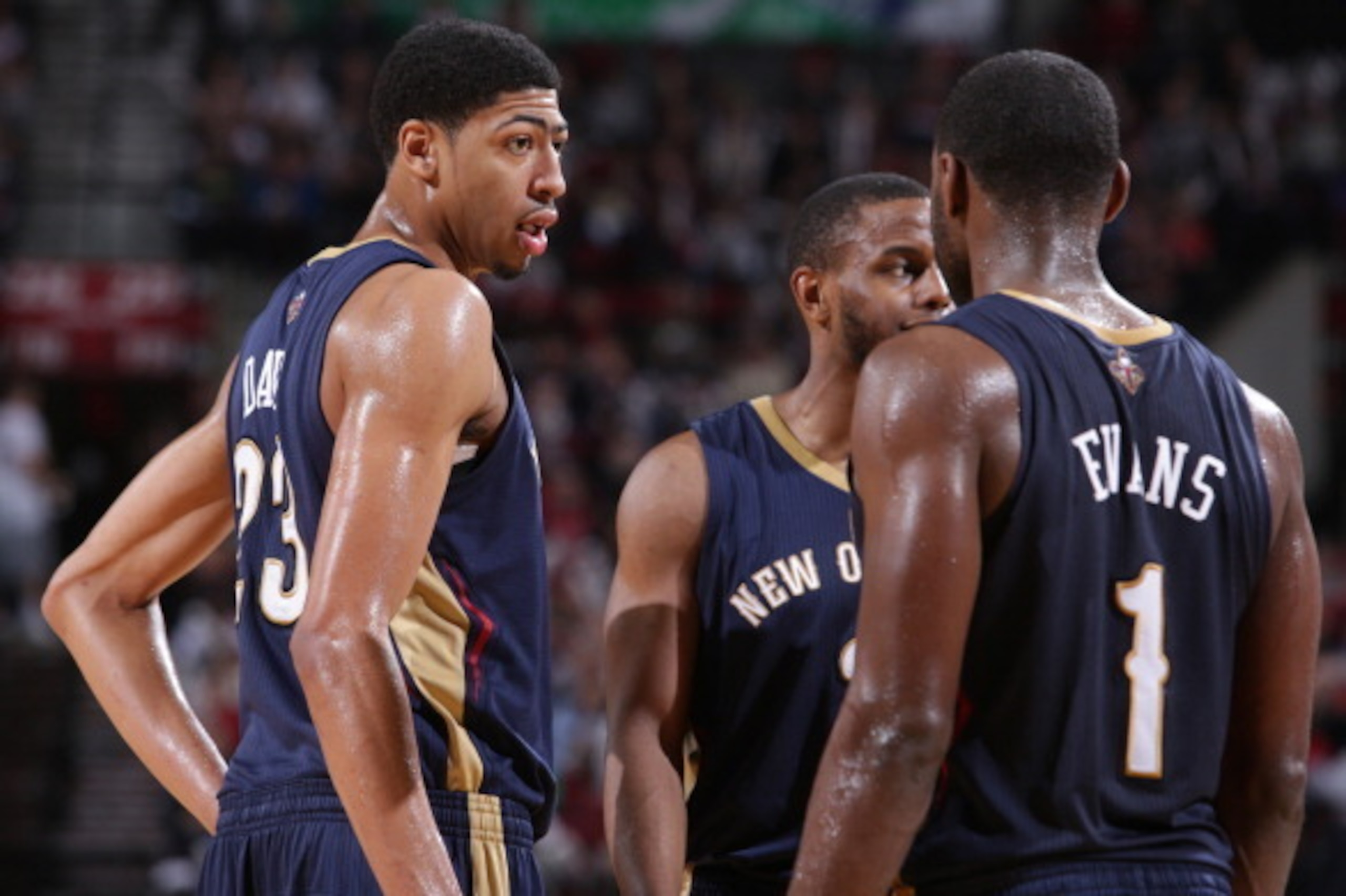 PORTLAND, OR - APRIL 6:  Anthony Davis #23 and Tyreke Evans #1 of the New Orleans Pelicans huddle up during the game against the Portland Trail Blazers on April 6, 2014 at the Moda Center Arena in Portland, Oregon. NOTE TO USER: User expressly acknowledge