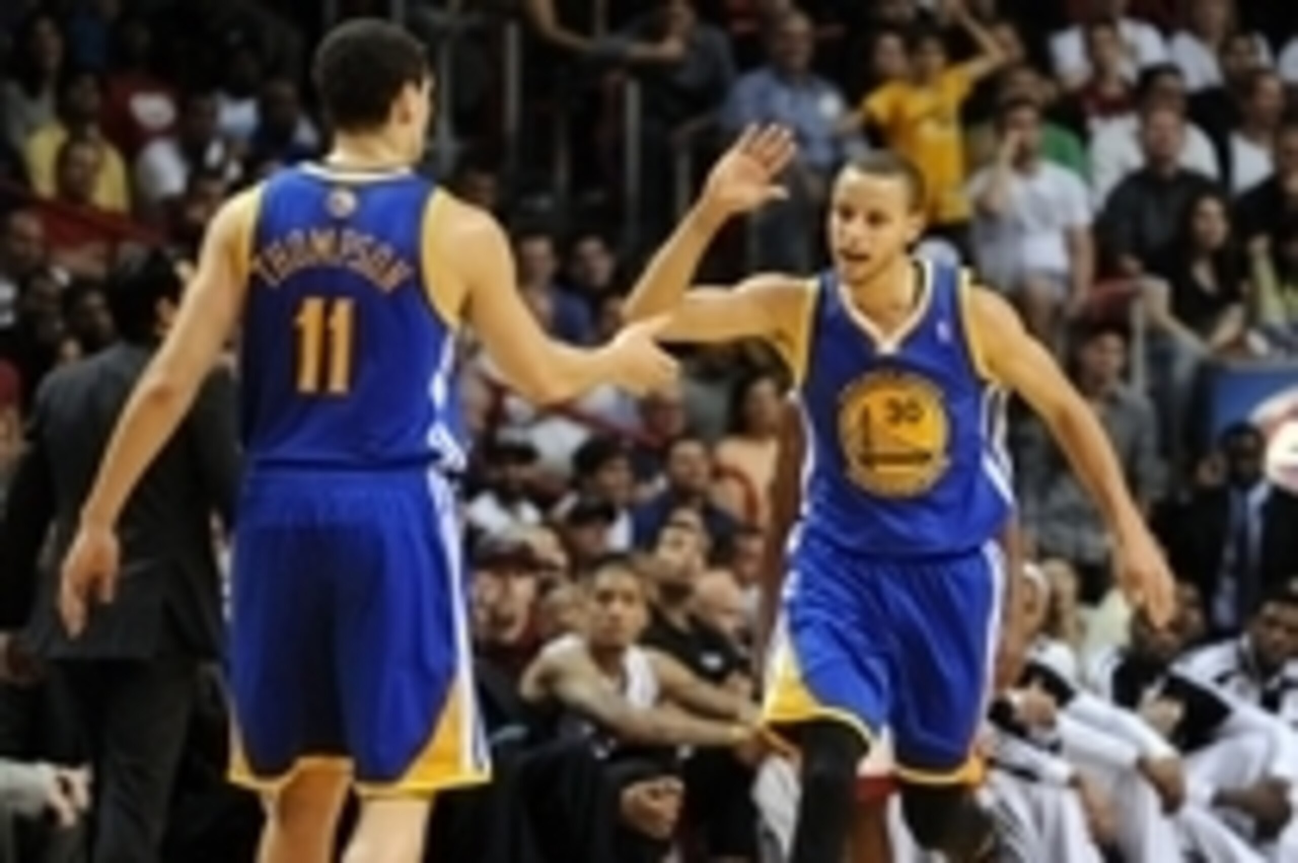 Jan 2, 2014; Miami, FL, USA; Golden State Warriors point guard Stephen Curry (right) greets teammate Golden State Warriors shooting guard Klay Thompson (left) during the second half against the Miami Heat at American Airlines Arena. Mandatory Credit: Stev Jan 2, 2014; Miami, FL, USA; Golden State Warriors point guard Stephen Curry (right) greets teammate Golden State Warriors shooting guard Klay Thompson (left) during the second half against the Miami Heat at American Airlines Arena. Mandatory Credit: Stev