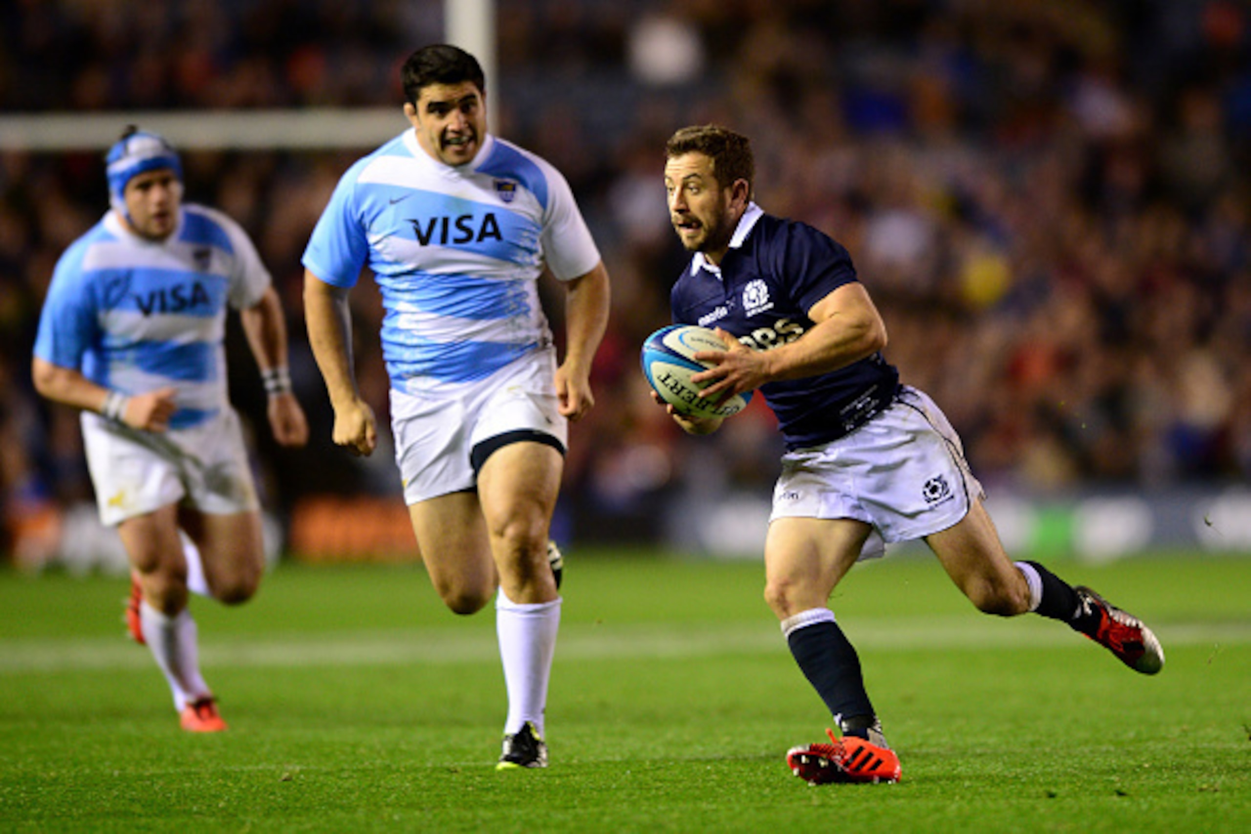 EDINBURGH, SCOTLAND - NOVEMBER 8:  Greig Laidlaw of Scotland break free of the Argentina back row to set up a Try for Stuart Hogg during the International match between Scotland and Argentina at Murrayfield Stadium on November 8, 2014 in Edinburgh, Scotla