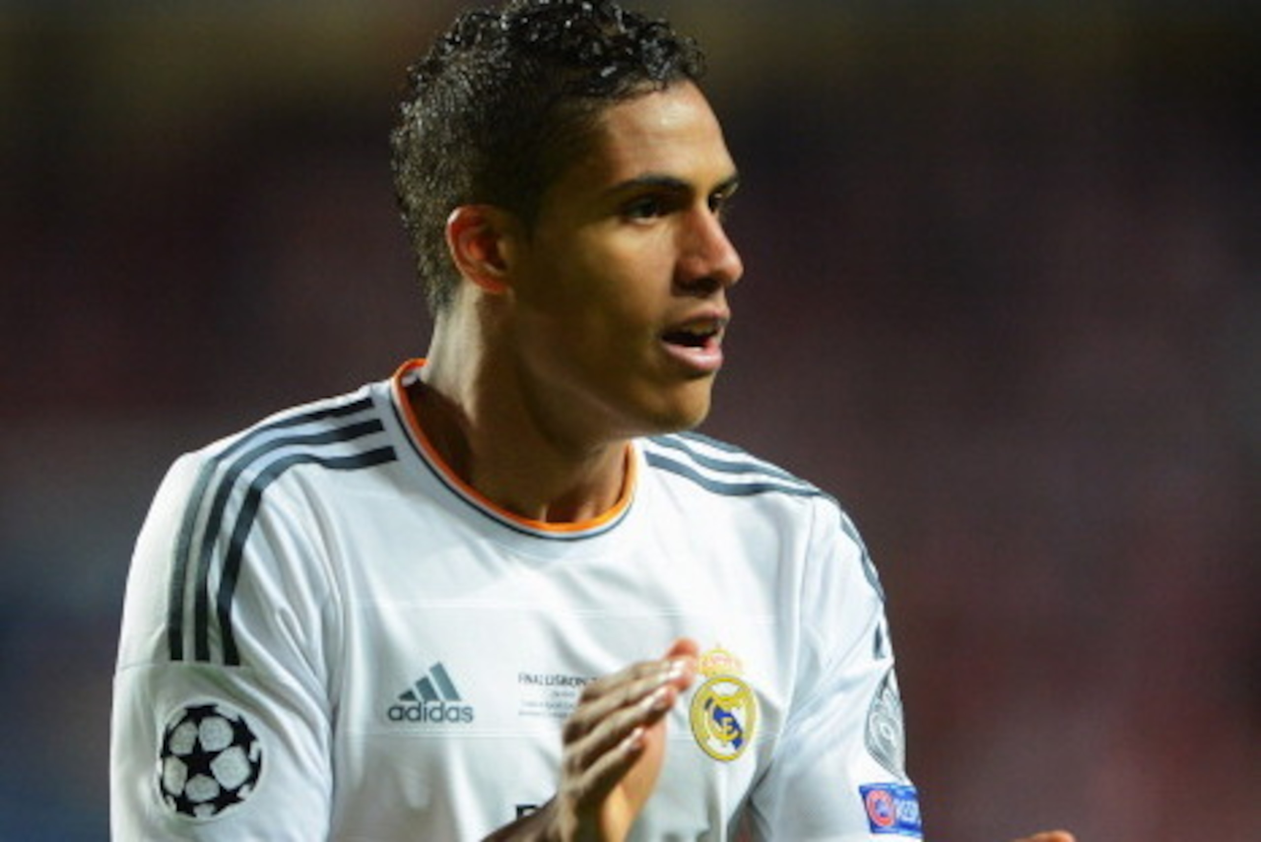 LISBON, PORTUGAL - MAY 24:  Raphael Varane of Real Madrid applauds during the UEFA Champions League Final between Real Madrid and Atletico de Madrid at Estadio da Luz on May 24, 2014 in Lisbon, Portugal.  (Photo by Michael Regan/Getty Images)