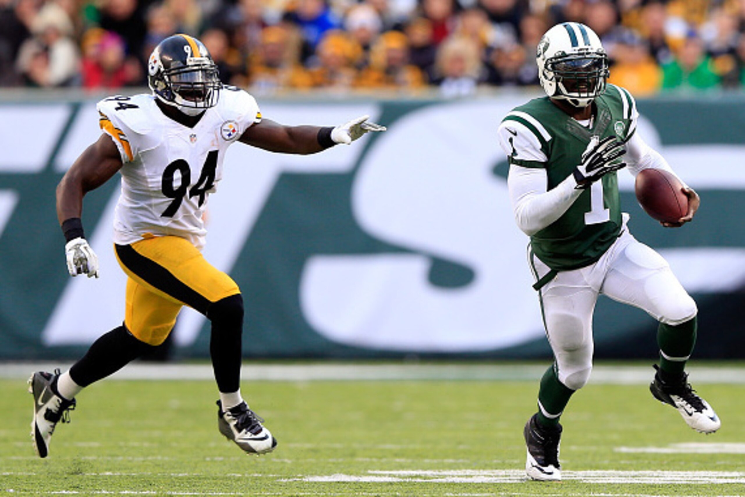 EAST RUTHERFORD, NJ - NOVEMBER 09:  Quarterback Michael Vick #1 of the New York Jets scrambles as inside linebacker Lawrence Timmons #94 of the Pittsburgh Steelers defends during a game at MetLife Stadium on November 9, 2014 in East Rutherford, New Jersey