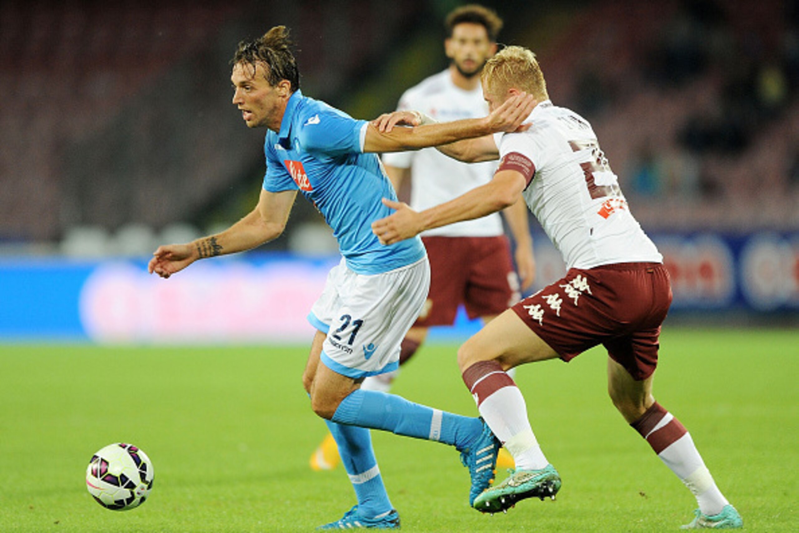 NAPLES, ITALY - October 5 :  Napoli's player Miguel Michu vies with Torino's player Kamil Glik during an Italian Serie A football match SSC Napoli vs Torino at the San Paolo Stadium in Naples on October 5, 2014. (Photo by Francesco Pecoraro/Getty Images)