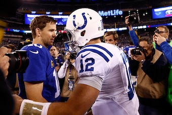 EAST RUTHERFORD, NJ - NOVEMBER 03:   Eli Manning #10 of the New York Giants shakes hands with Andrew Luck #12 of the Indianapolis Colts after their game at MetLife Stadium on November 3, 2014 in East Rutherford, New Jersey. The Indianapolis Colts defeated