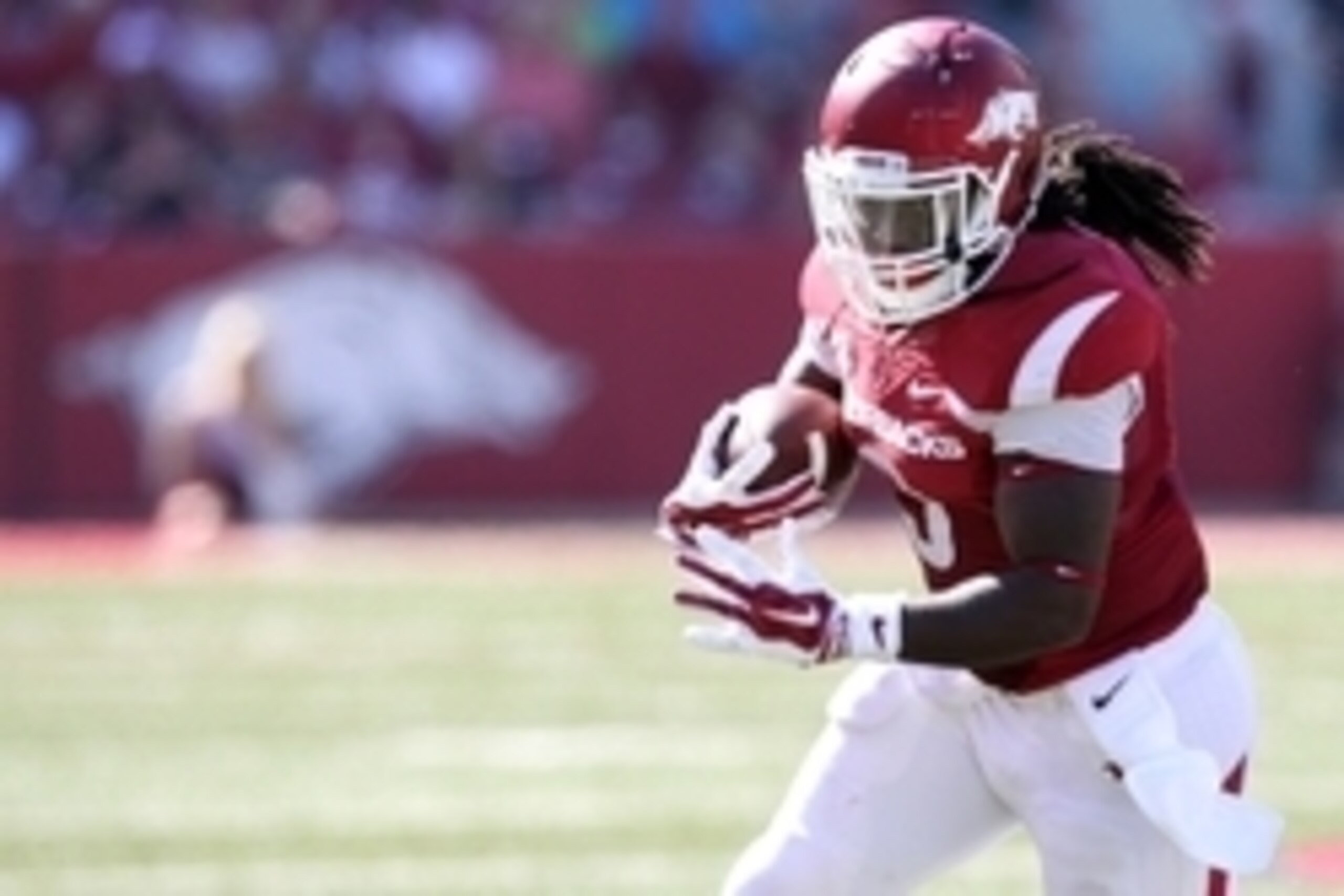 Oct 25, 2014; Fayetteville, AR, USA; Arkansas Razorbacks running back Alex Collins (3) rushes during the second quarter against the UAB Blazers at Donald W. Reynolds Razorback Stadium. Mandatory Credit: Nelson Chenault-USA TODAY Sports