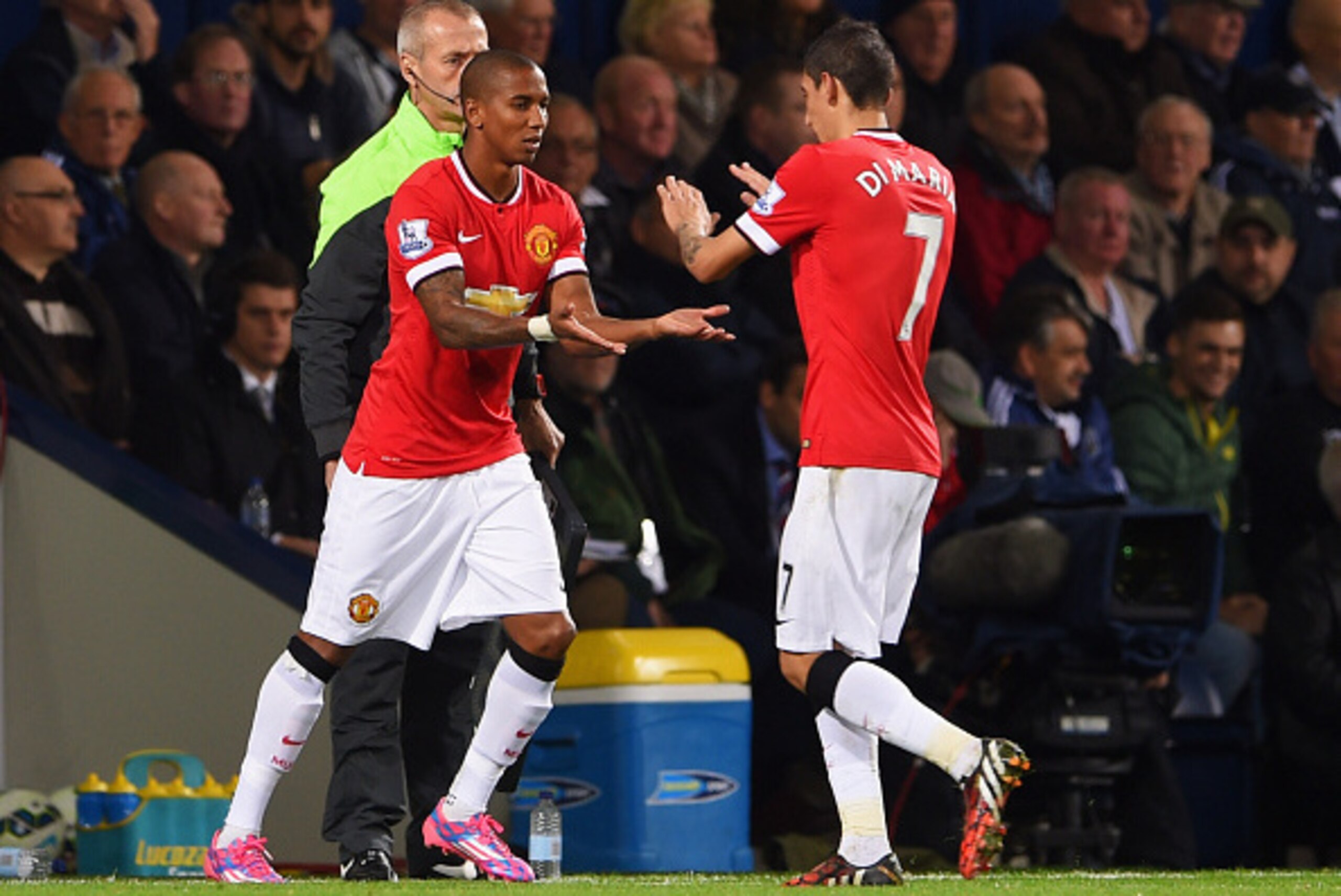 WEST BROMWICH, ENGLAND - OCTOBER 20:  Ashley Young of Manchester United replaces team mate Angel di Maria (R) as a substitute during the Barclays Premier League match between West Bromwich Albion and Manchester United at The Hawthorns on October 20, 2014 