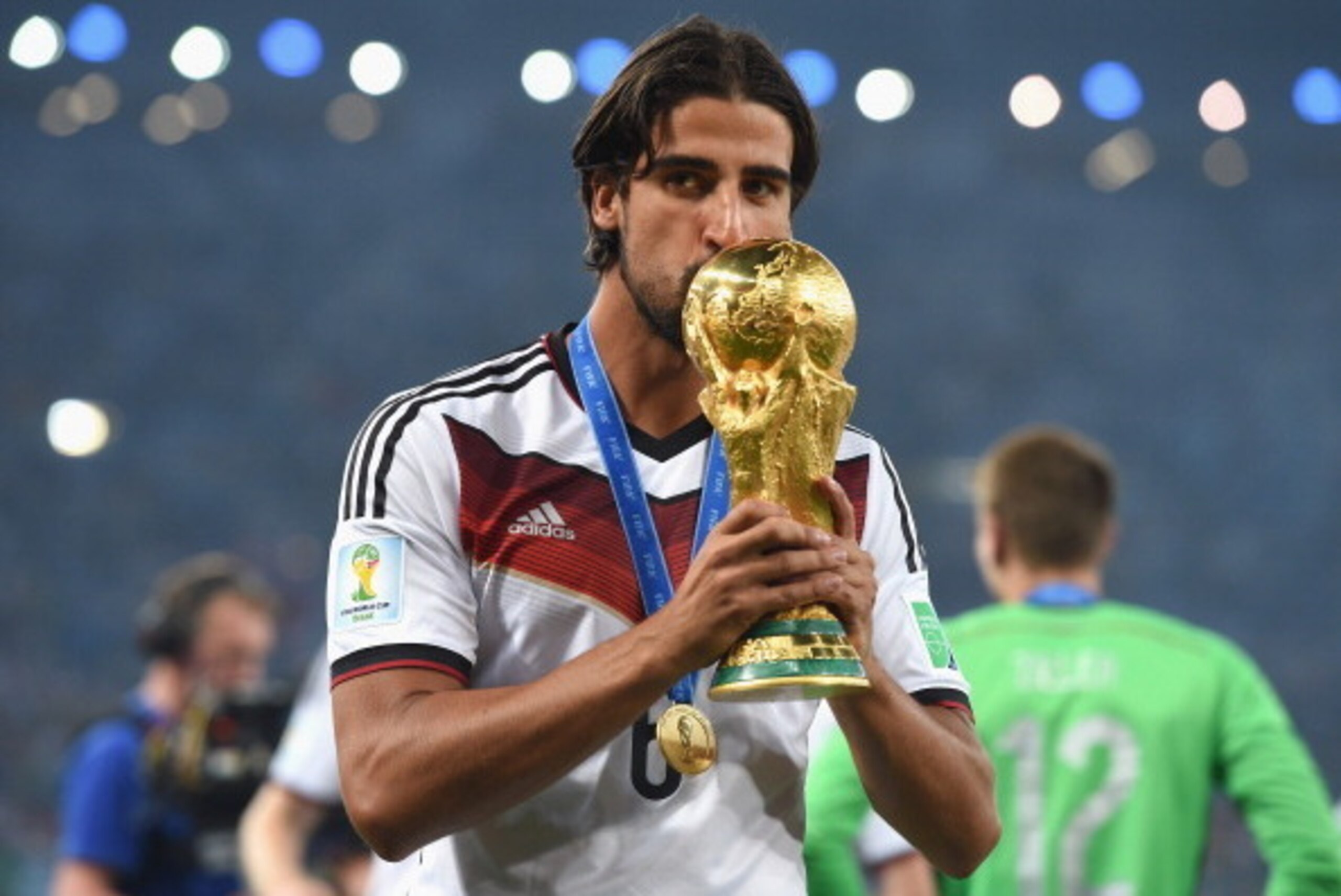 RIO DE JANEIRO, BRAZIL - JULY 13:  Sami Khedira of Germany kisses the World Cup trophy  after defeating Argentina 1-0 in extra time during the 2014 FIFA World Cup Brazil Final match between Germany and Argentina at Maracana on July 13, 2014 in Rio de Jane