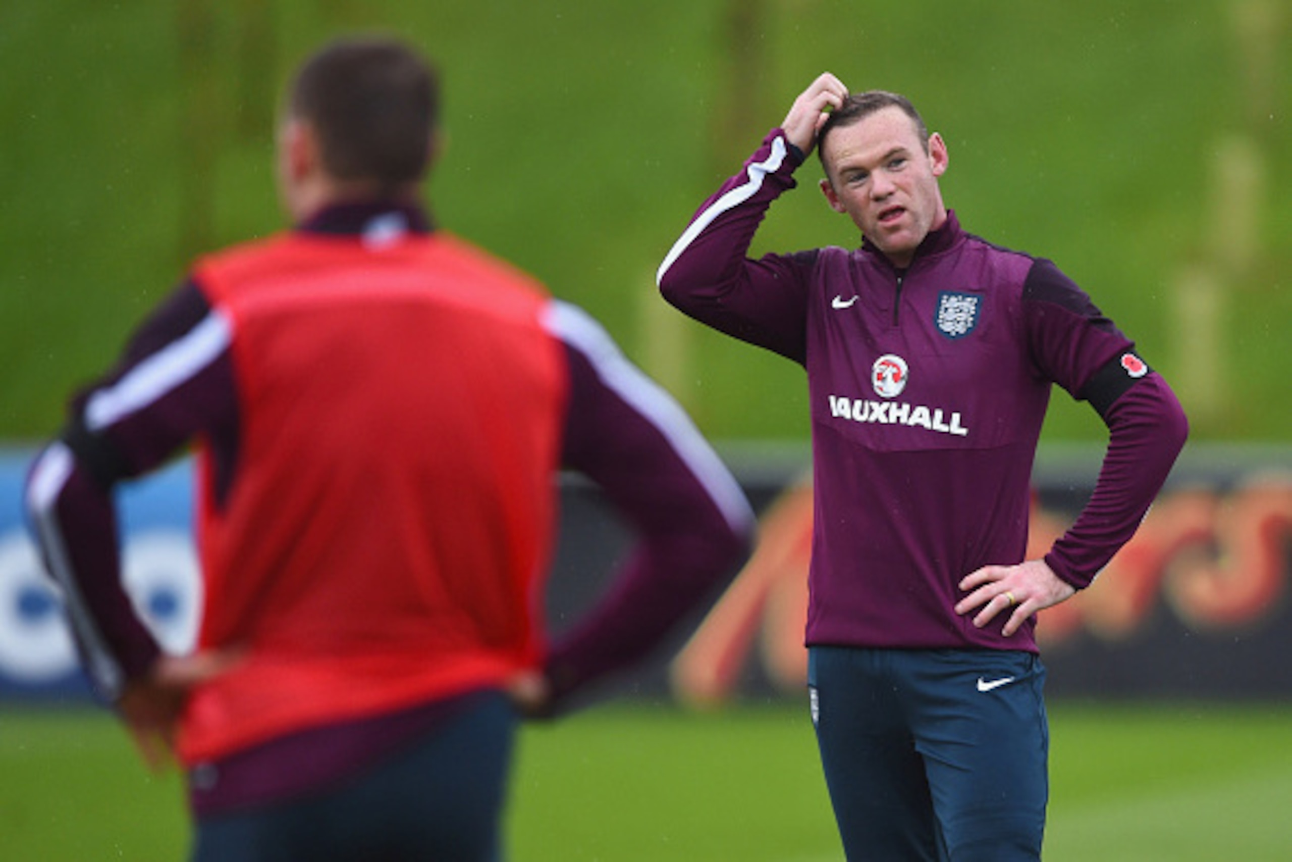 BURTON-UPON-TRENT, ENGLAND - NOVEMBER 11:  Wayne Rooney looks thoughtful during an England training session, ahead of the UEFA European Championship qualifier against Slovenia, at St Georges Park on November 11, 2014 in Burton-upon-Trent, England.  (Photo