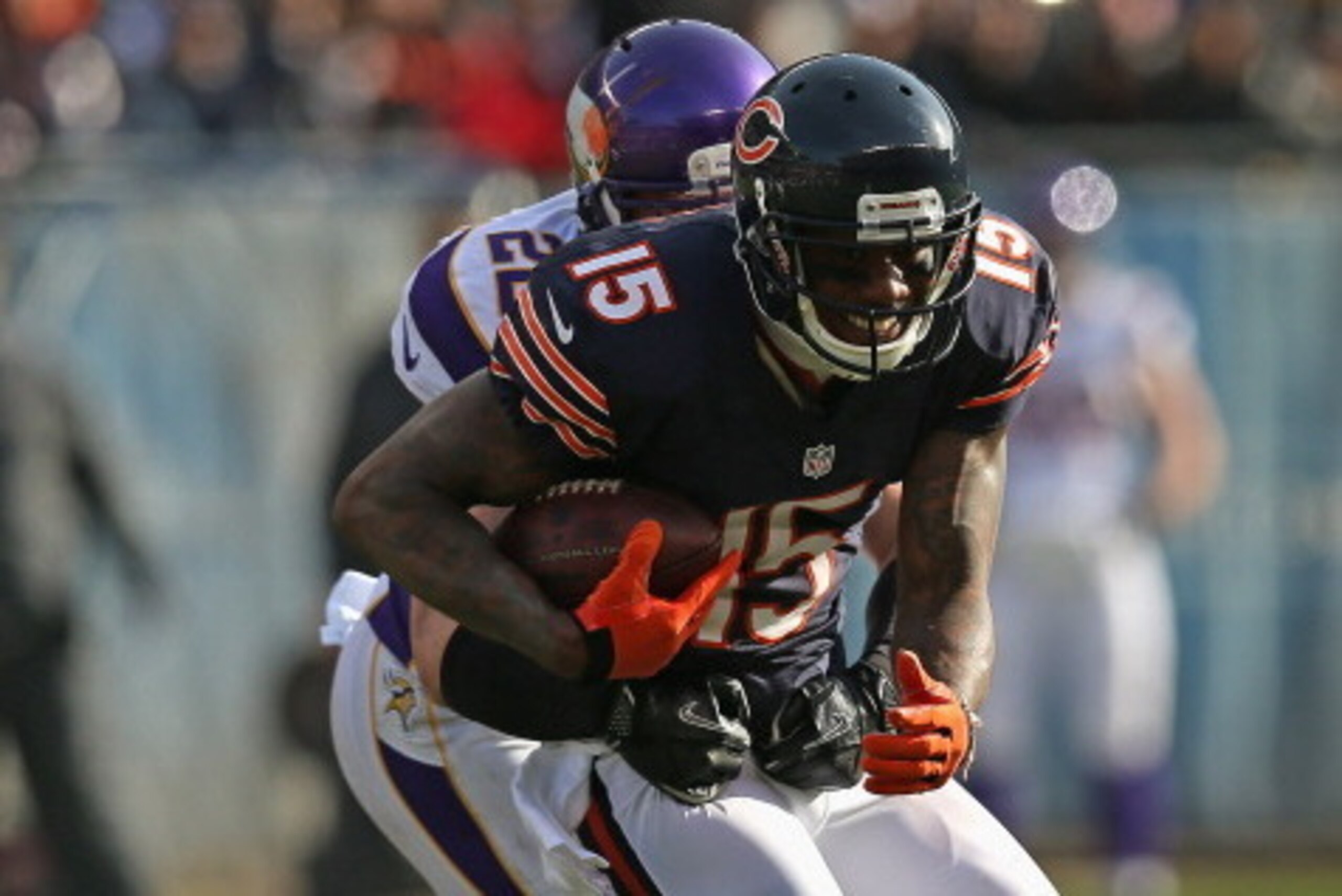 CHICAGO, IL - NOVEMBER 25:  Brandon Marshall #15 of the Chicago Bears tries to escape Harrison Smith #22 of the Minnesota Vikings at Soldier Field on November 25, 2012 in Chicago, Illinois. The Bears defeated the Vikings 28-10.  (Photo by Jonathan Daniel/