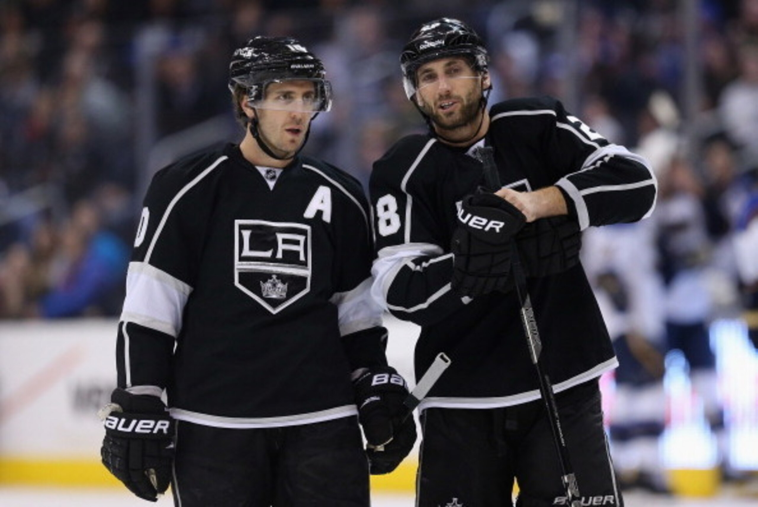 LOS ANGELES, CA - DECEMBER 02:  Mike Richards (L) #10 and Jarret Stoll #28 of the Los Angeles Kings talk against the St. Louis Blues at Staples Center on December 2, 2013 in Los Angeles, California.  (Photo by Jeff Gross/Getty Images)