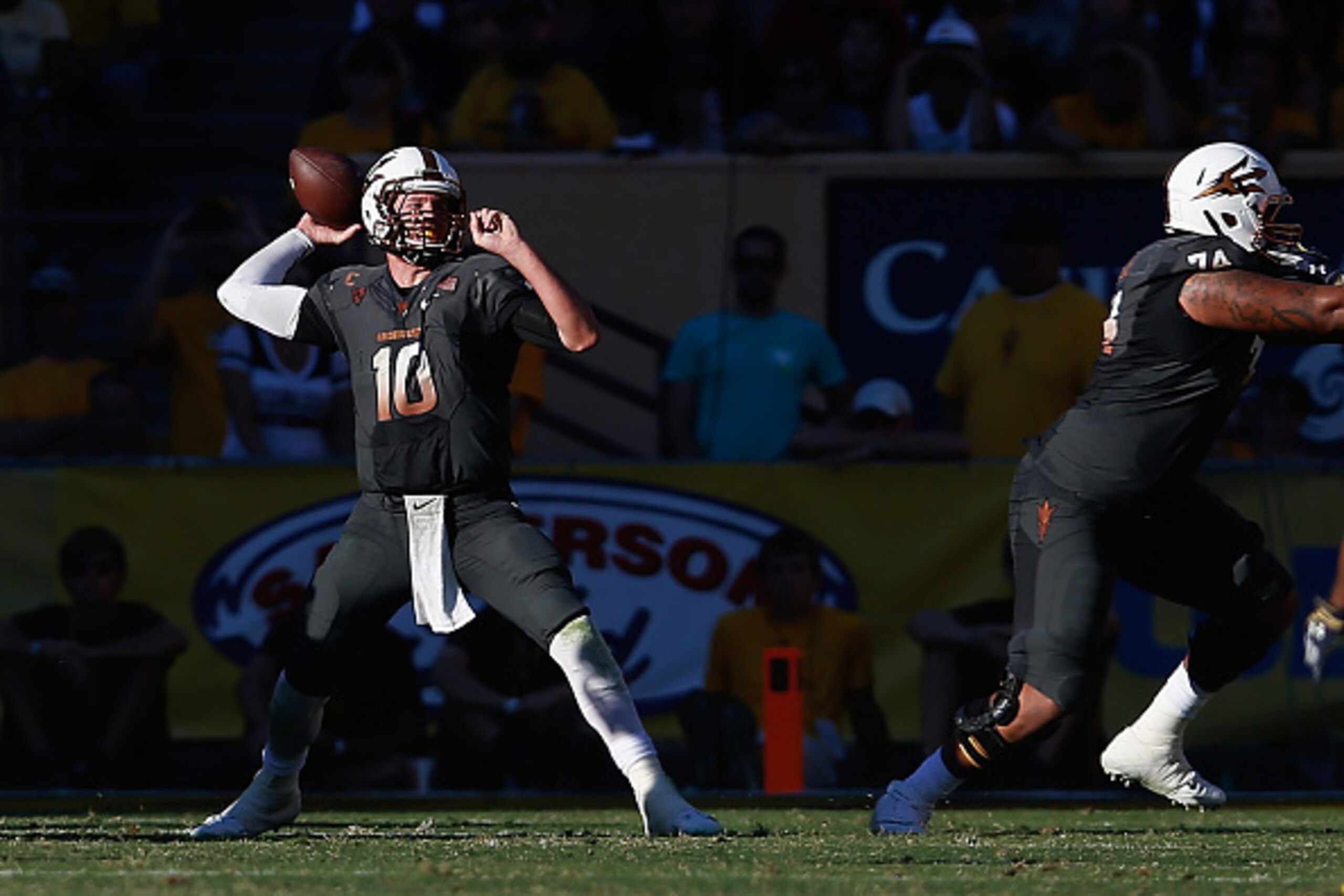 TEMPE, AZ - NOVEMBER 08:  Quarterback Taylor Kelly #10 of the Arizona State Sun Devils throws a pass during the college football game against the Notre Dame Fighting Irish at Sun Devil Stadium on November 8, 2014 in Tempe, Arizona. The Sun Devils defeated