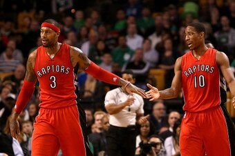 BOSTON, MA - NOVEMBER 05: James Johnson #3 and DeMar DeRozan #10 of the Toronto Raptors react after a play in the second half at TD Garden on November 5, 2014 in Boston, Massachusetts. NOTE TO USER: User expressly acknowledges and agrees that, by download