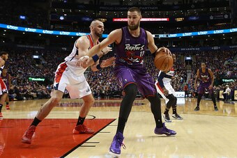 TORONTO,ON - NOVEMBER 7:  Marcin Gortat #4 of the Washington Wizards defends against Jonas Valanciunas #17 of the Toronto Raptors during their NBA game at the Air Canada Centre on November 7, 2014 in Toronto, Ontario, Canada. NOTE TO USER: User expressly 