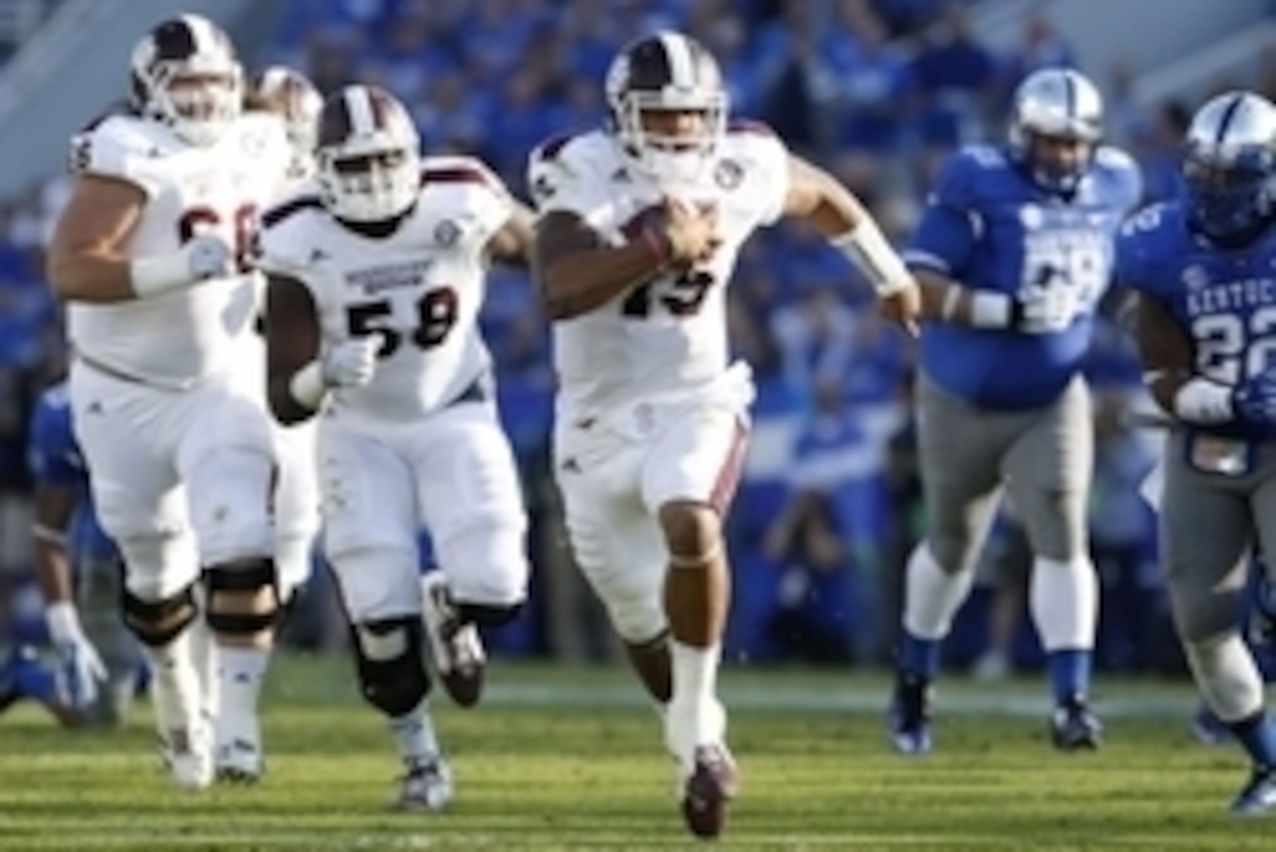 Oct 25, 2014; Lexington, KY, USA; Mississippi State Bulldogs quarterback Dak Prescott (15) runs the ball in the first half against the Kentucky Wildcats at Commonwealth Stadium. Mandatory Credit: Mark Zerof-USA TODAY Sports