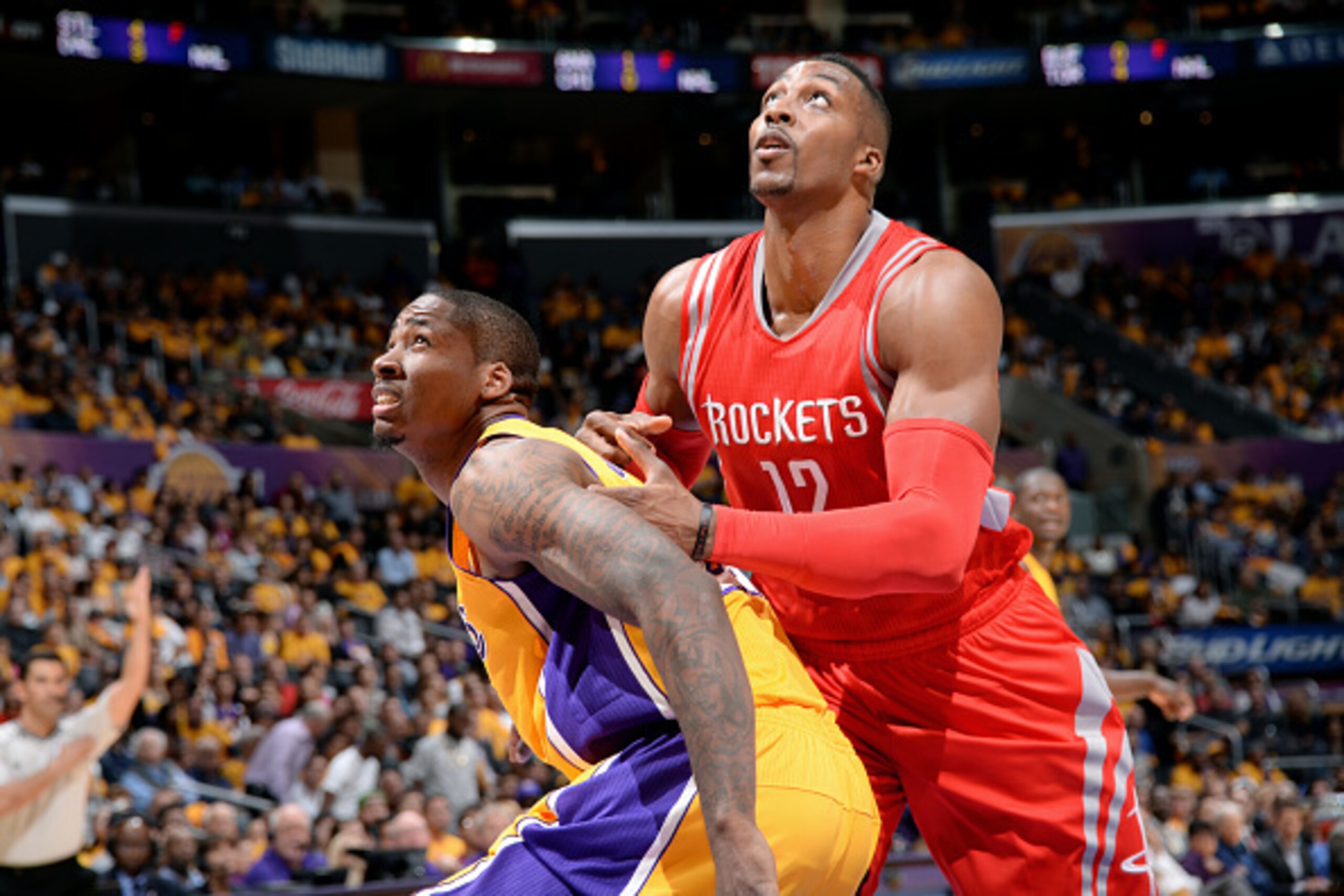 LOS ANGELES, CA - OCTOBER 28: Ed Davis #21 of the Los Angeles Lakers battles for position against Dwight Howard #12 of the Houston Rockets on October 28, 2014 at the Staples Center in Los Angeles, California. NOTE TO USER: User expressly acknowledges and 