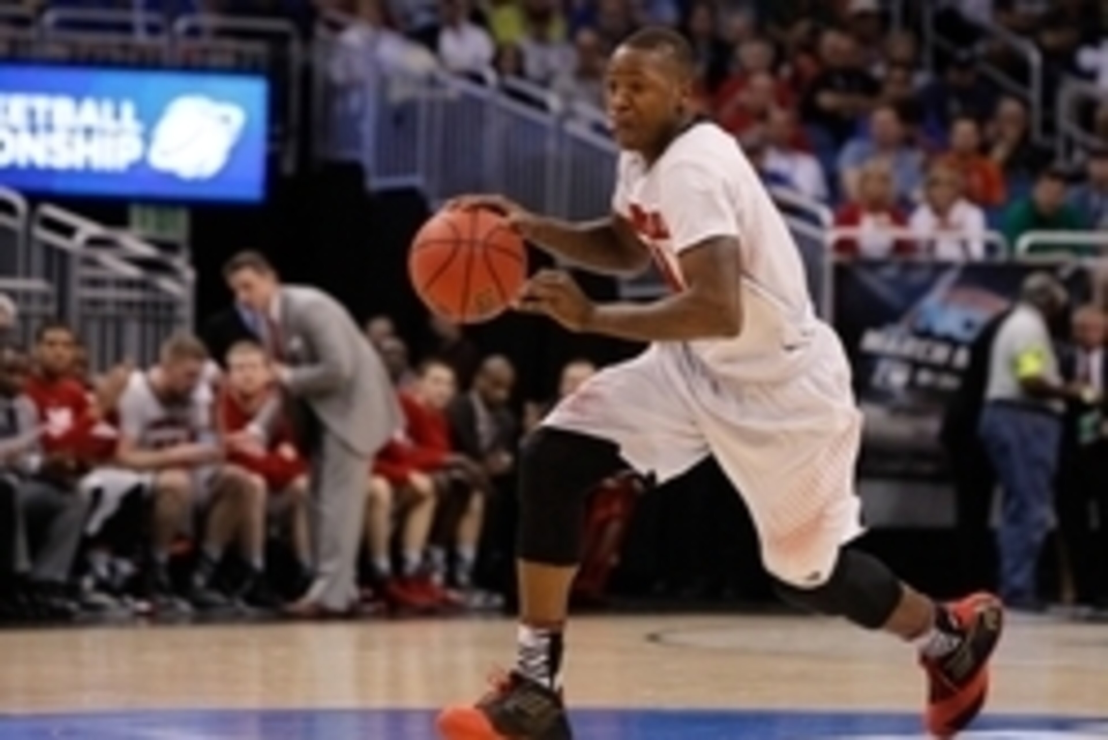 Mar 22, 2014; Orlando, FL, USA; Louisville Cardinals guard Terry Rozier (0) drives to the basket against the Saint Louis Billikens in the first half of a men's college basketball game during the third round of the 2014 NCAA Tournament at Amway Center. Man Mar 22, 2014; Orlando, FL, USA; Louisville Cardinals guard Terry Rozier (0) drives to the basket against the Saint Louis Billikens in the first half of a men's college basketball game during the third round of the 2014 NCAA Tournament at Amway Center. Man