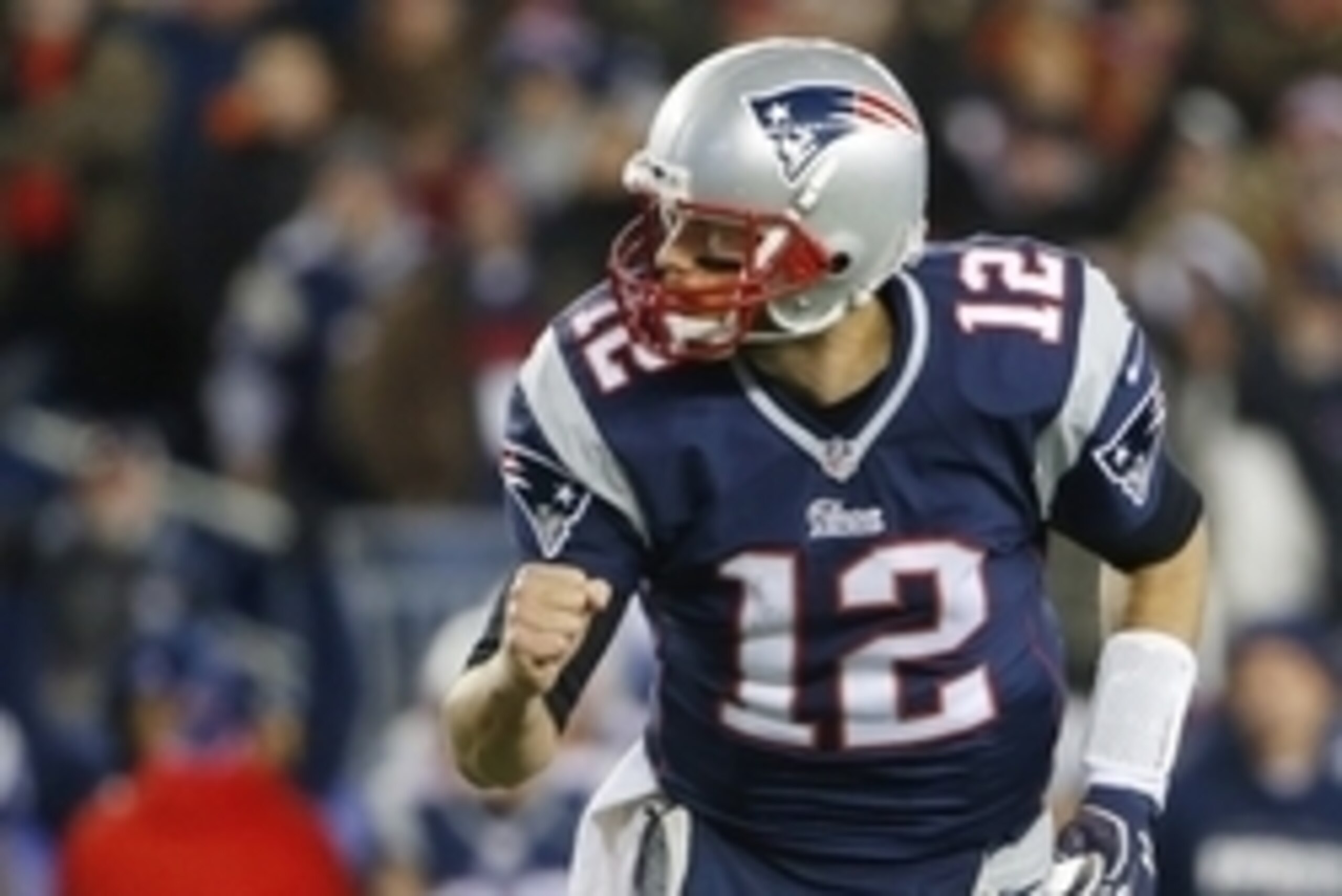 Nov 2, 2014; Foxborough, MA, USA; New England Patriots quarterback Tom Brady (12) pumps his fist after a touchdown throw during the third quarter of New England's 43-21 win over the Denver Broncos at Gillette Stadium. Mandatory Credit: Winslow Townson-USA