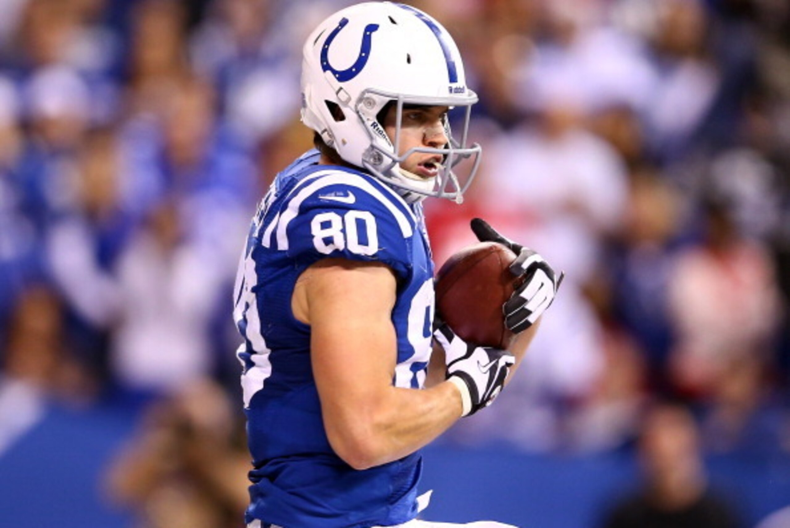 INDIANAPOLIS, IN - JANUARY 04:  Tight end Coby Fleener #80 of the Indianapolis Colts catches a touchdown pass in the third quarter against the Kansas City Chiefs during a Wild Card Playoff game at Lucas Oil Stadium on January 4, 2014 in Indianapolis, Indi