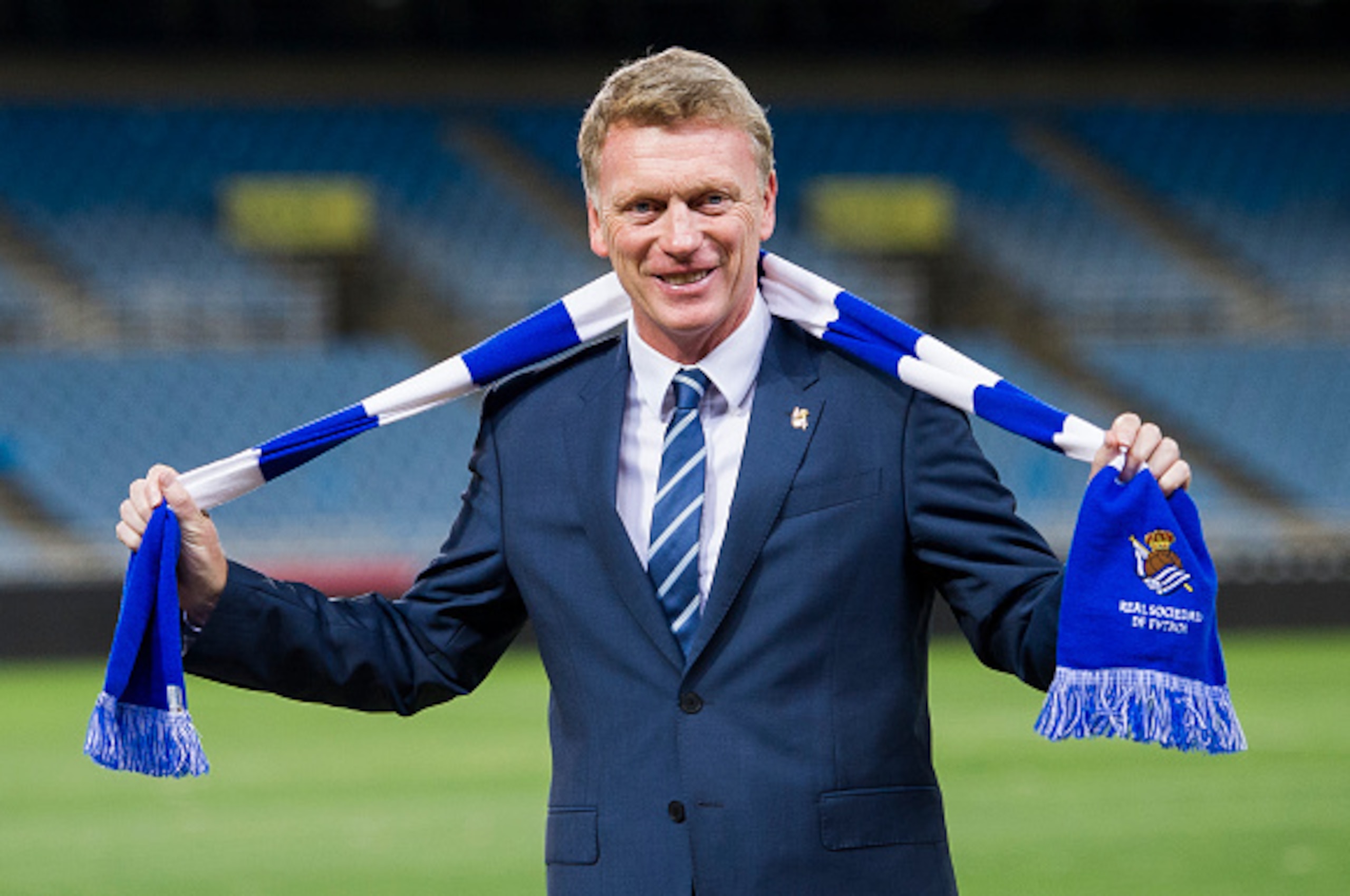 SAN SEBASTIAN, SPAIN - NOVEMBER 13: David Moyes poses with a scarf during presented as Real Sociedad's new head coach at Estadio Anoeta on November 13, 2014 in San Sebastian, Spain. (Photo by Juan Manuel Serrano Arce/Getty Images) SAN SEBASTIAN, SPAIN - NOVEMBER 13: David Moyes poses with a scarf during presented as Real Sociedad's new head coach at Estadio Anoeta on November 13, 2014 in San Sebastian, Spain. (Photo by Juan Manuel Serrano Arce/Getty Images)