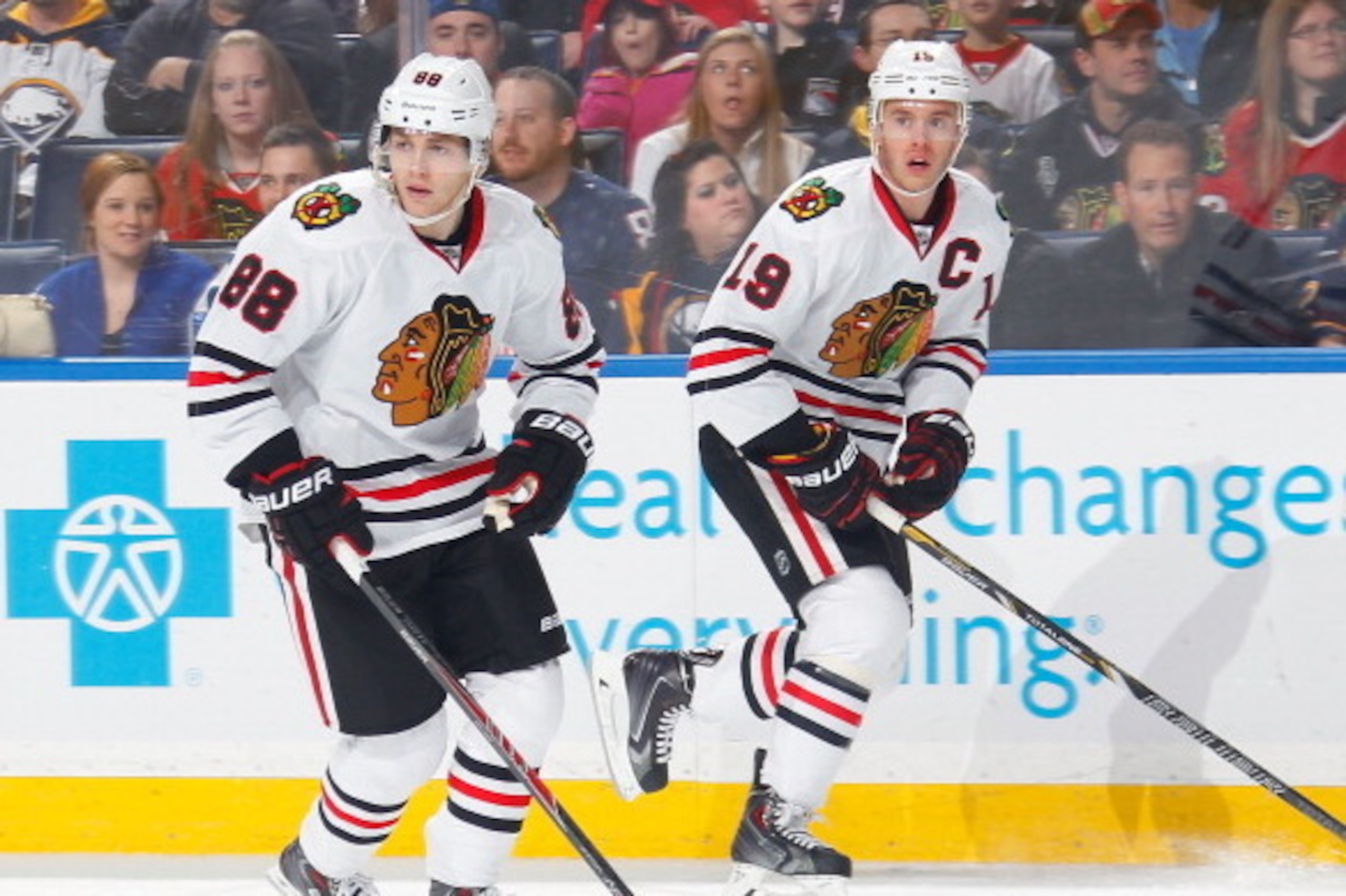 BUFFALO, NY - MARCH 09:  Jonathan Toews #19 and Patrick Kane #88 of the Chicago Blackhawks skate against the Buffalo Sabres on March 9, 2014 at the First Niagara Center in Buffalo, New York.  (Photo by Bill Wippert/NHLI via Getty Images)