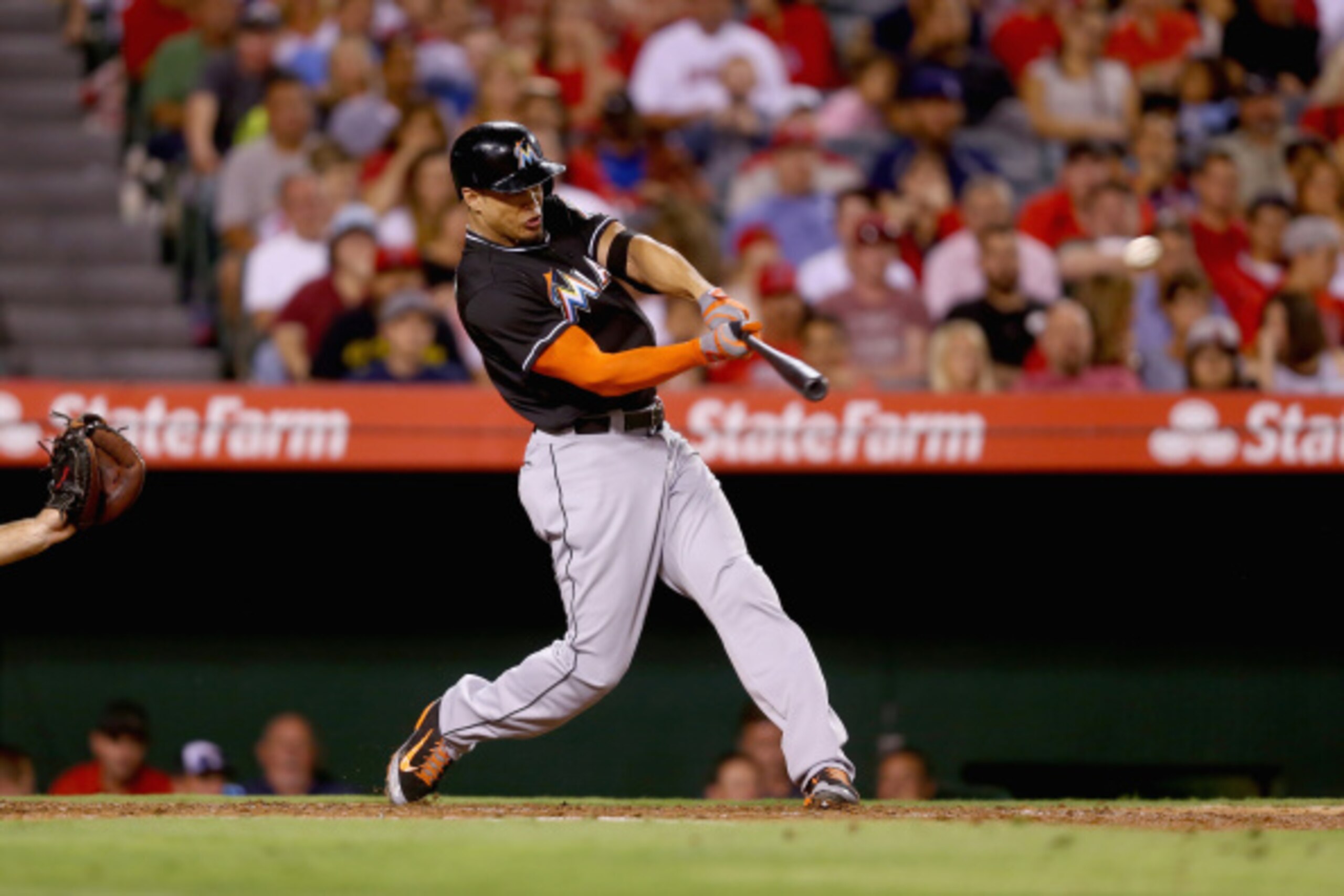 ANAHEIM, CA - AUGUST 25:  Giancarlo Stanton #27 of the Miami Marlins hits a three-run home run against the Los Angeles Angels of Anaheim in the fourth inning at Angel Stadium of Anaheim on August 25, 2014 in Anaheim, California.  (Photo by Jeff Gross/Gett