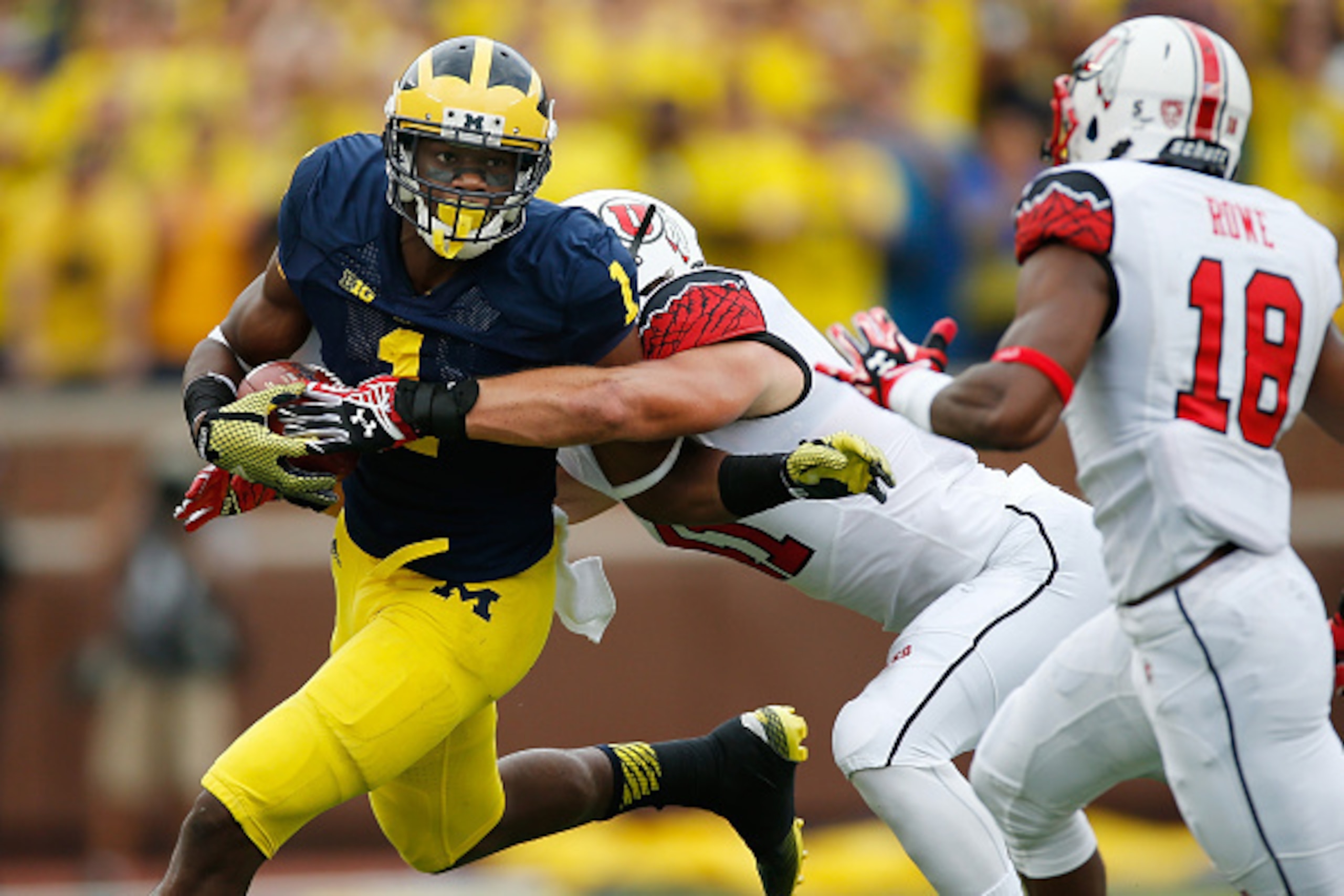 ANN ARBOR, MI - SEPTEMBER 20: Devin Funchess #1 of the Michigan Wolverines tries to break the tackle of Jared Norris #41 of the Utah Utes after a first quarter catch on September 20, 2014 at Michigan Stadium in Ann Arbor, Michigan. (Photo by Gregory Sha ANN ARBOR, MI - SEPTEMBER 20: Devin Funchess #1 of the Michigan Wolverines tries to break the tackle of Jared Norris #41 of the Utah Utes after a first quarter catch on September 20, 2014 at Michigan Stadium in Ann Arbor, Michigan. (Photo by Gregory Sha