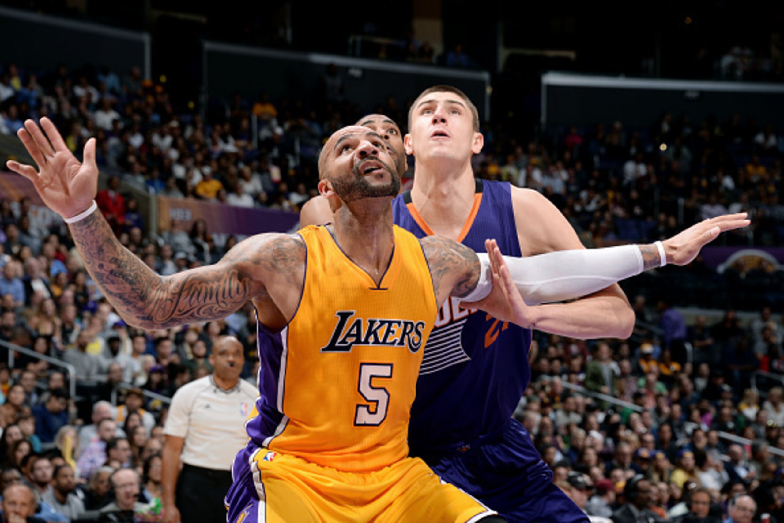 LOS ANGELES, CA - NOVEMBER 04: Carlos Boozer #5 of the Los Angeles Lakers battles for position against Alex Len #21 of the Phoenix Suns at STAPLES Center on November 04, 2014 in Los Angeles, California. NOTE TO USER: User expressly acknowledges and agrees