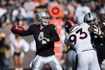 OAKLAND, CA - NOVEMBER 09:  Derek Carr #4 of the Oakland Raiders looks downfield against the Denver Broncos at O.co Coliseum on November 9, 2014 in Oakland, California.  (Photo by Thearon W. Henderson/Getty Images)