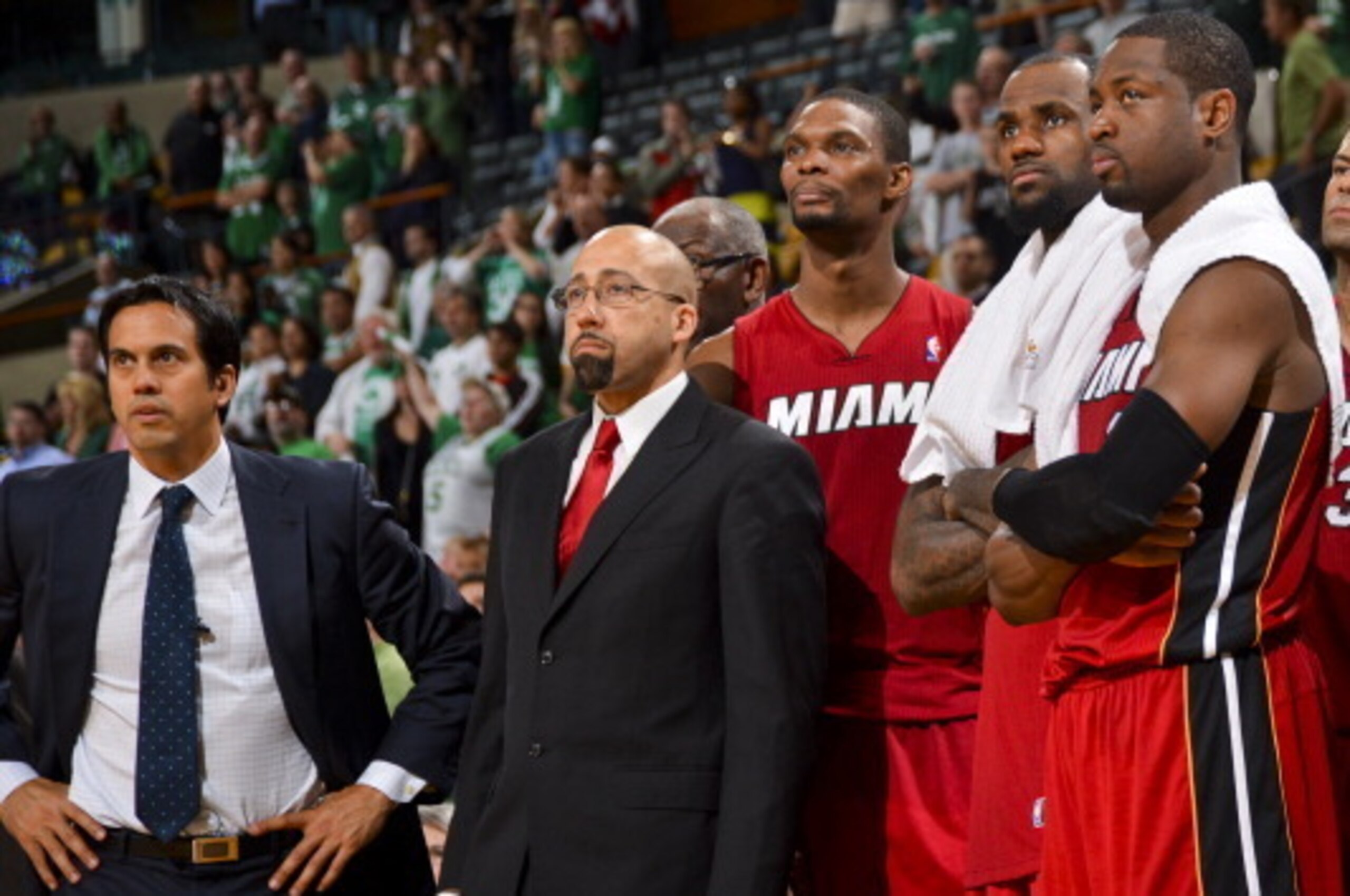 BOSTON, MA - JUNE 7: Miami Heat players Chris Bosh #1, LeBron James #6 and Dwyane Wade #3, and head coach Erik Spoelstra look on from the bench in the fourth quarter after their team pulled ahead of the Boston Celtics in Game Six of the Eastern Conference
