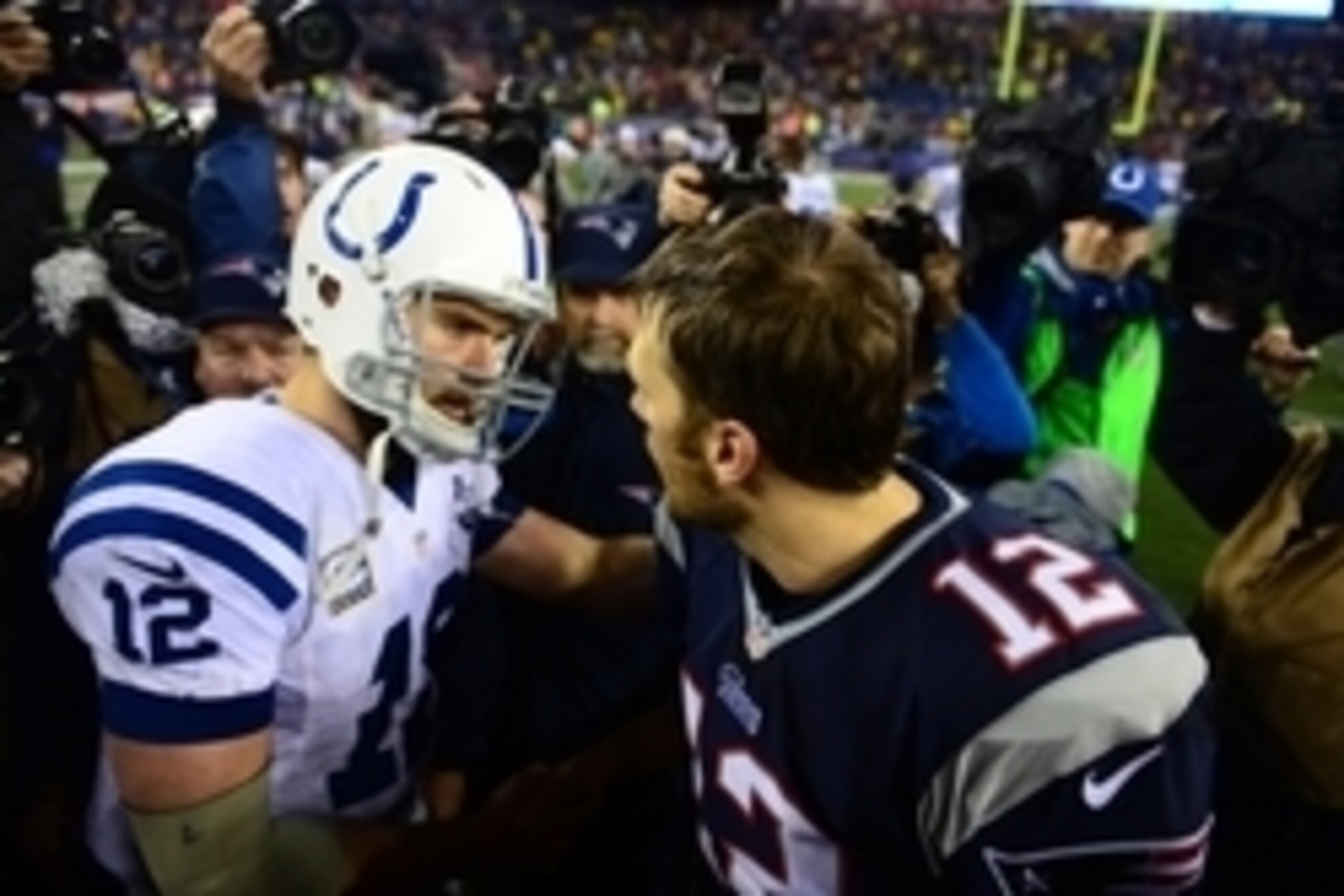 Jan 11, 2014; Foxborough, MA, USA; New England Patriots quarterback Tom Brady (12) shakes hands with Andrew Luck (12) after the 2013 AFC divisional playoff football game at Gillette Stadium. Mandatory Credit: Andrew Weber-USA TODAY Sports