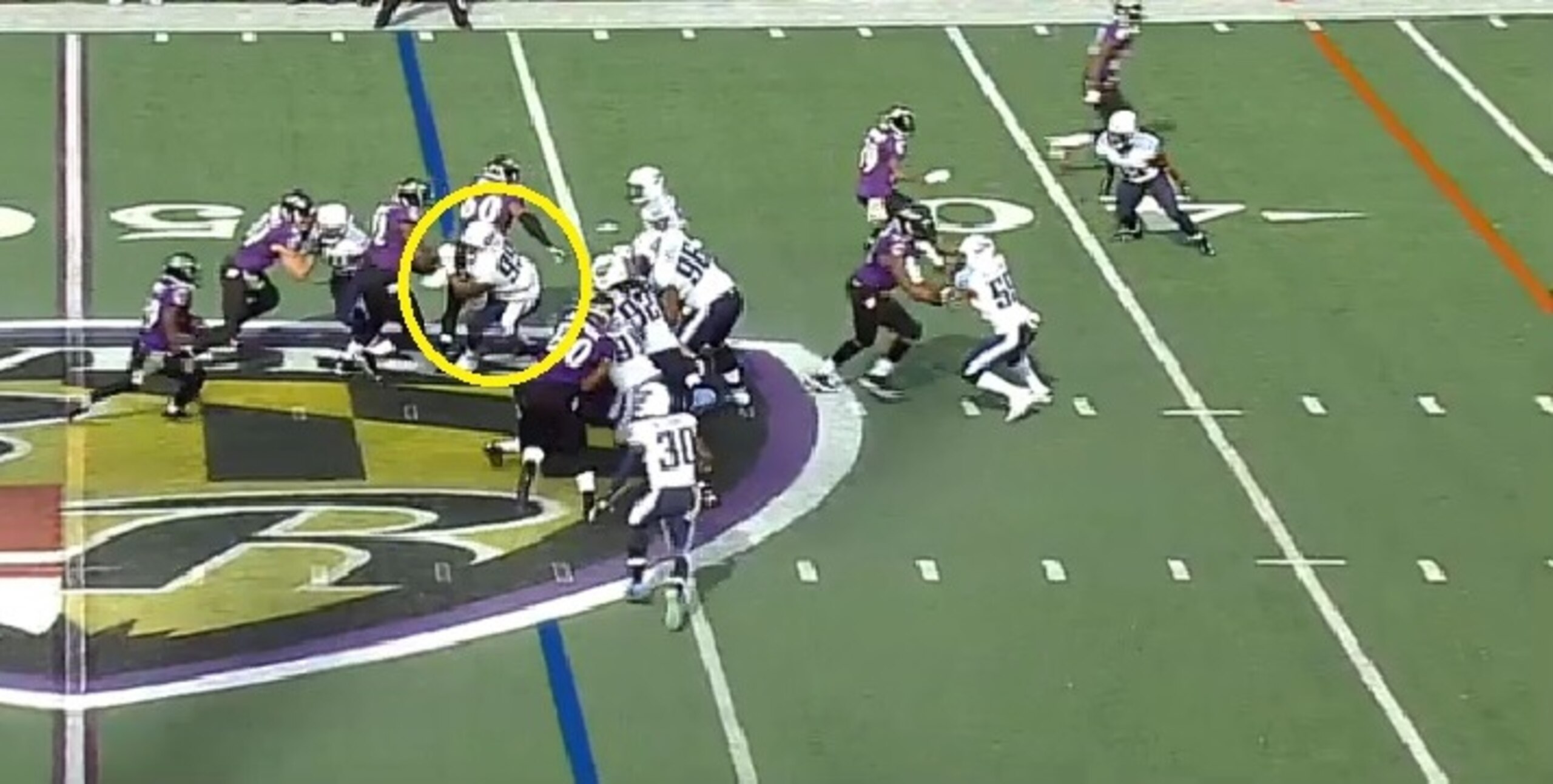 Jurrell Casey fights off the guard to stop Justin Forsett for a two-yard gain.