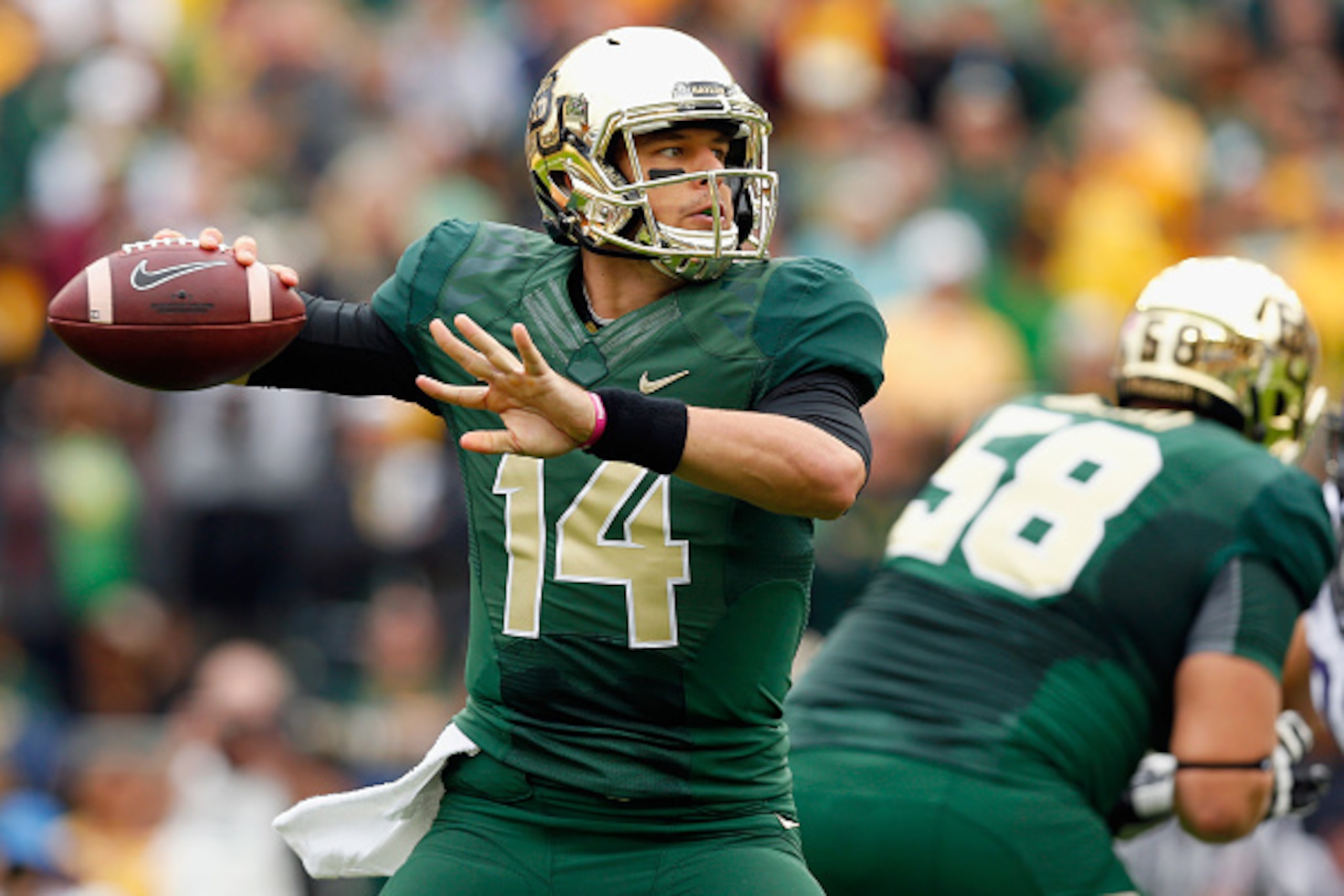 WACO, TX - OCTOBER 11:  Bryce Petty #14 of the Baylor Bears looks for an open receiver in the first half against the TCU Horned Frogs at McLane Stadium on October 11, 2014 in Waco, Texas.  (Photo by Tom Pennington/Getty Images)