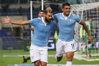 ROME, ITALY - NOVEMBER 03:  Honorato Ederson (R) with his teammate Antonio Candreva of SS Lazio celebrates after scoring the fourth team's goal during the Serie A match between SS Lazio and Cagliari Calcio at Stadio Olimpico on November 3, 2014 in Rome, I