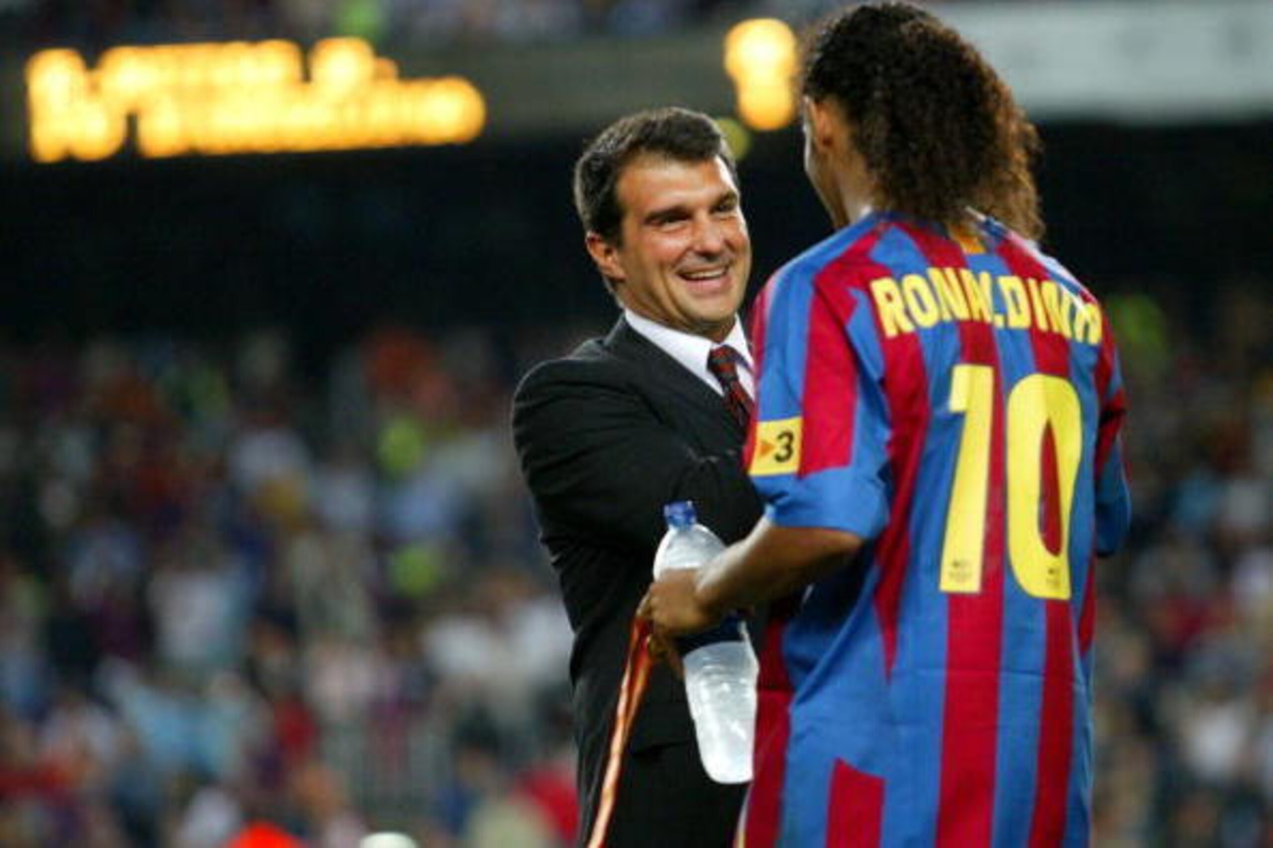BARCELONA, SPAIN - AUGUST 20:  FC Barcelona president Joan Laporta congratulates Samuel Etoo with winning the match between FC Barcelona and Real Betis during the Spain Supercup Final on August 20, 2005 at Camp Nou stadium in Barcelona, Spain.  (Photo by 