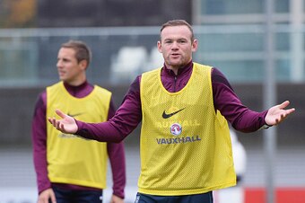 BURTON-UPON-TRENT, ENGLAND - NOVEMBER 14:  Wayne Rooney of England gestures during an England training session, ahead of the UEFA European Championship qualifier match against Slovenia, at St Georges Park on November 14, 2014 in Burton-upon-Trent, England