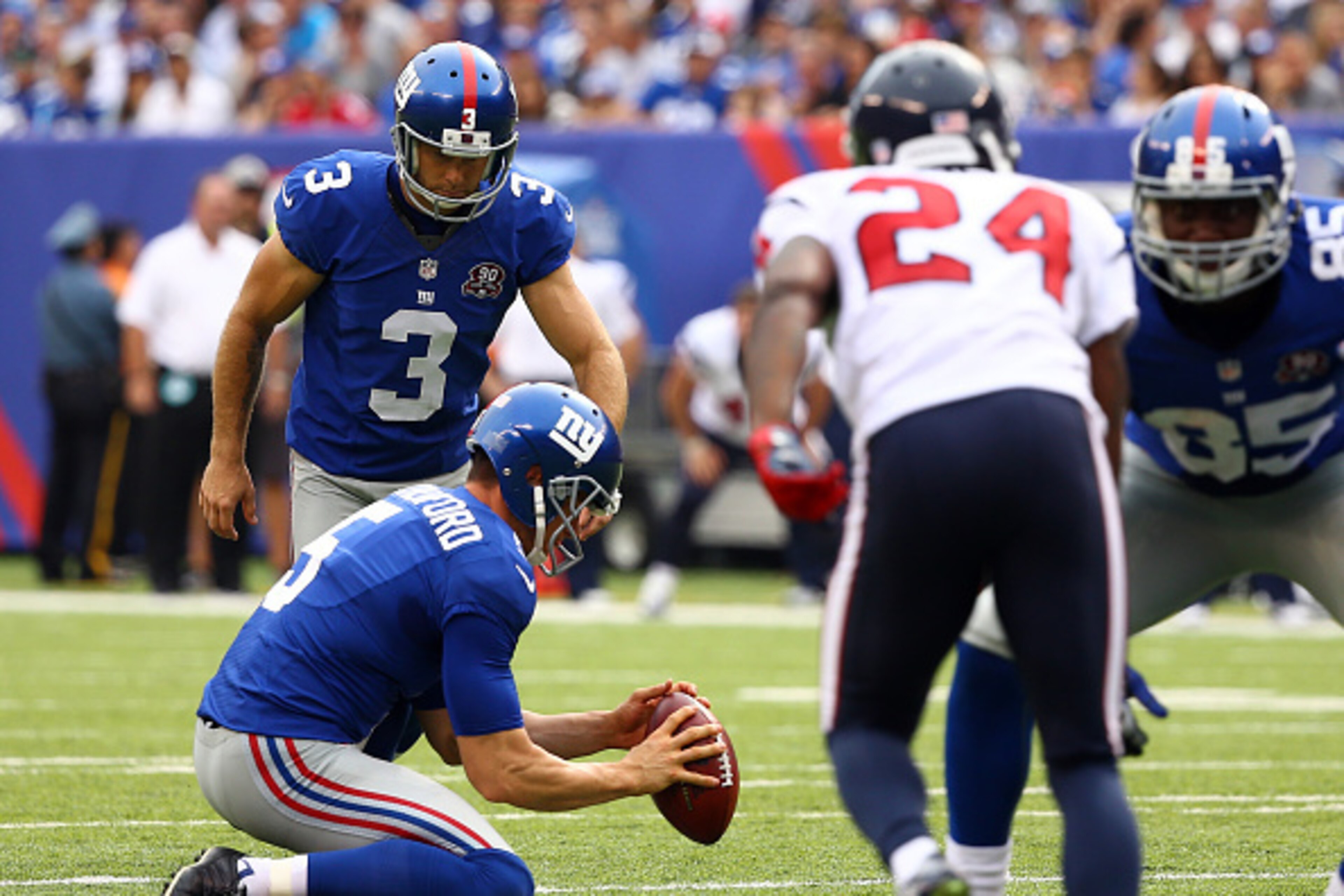 EAST RUTHERFORD, NJ - SEPTEMBER 21:  Josh Brown #3 attempts a field goal as  Steve Weatherford #5 of the New York Giants holds the ball against the Houston Texans at MetLife Stadium on September 21, 2014 in East Rutherford, New Jersey.  (Photo by Al Bello