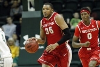 Jan 4, 2014; Tampa, FL, USA; Houston Cougars forward TaShawn Thomas (35) drives to the basket against the South Florida Bulls during the second half at USF Sun Dome. Mandatory Credit: Houston Cougars defeated the South Florida Bulls 67-58. Kim Klement-USA