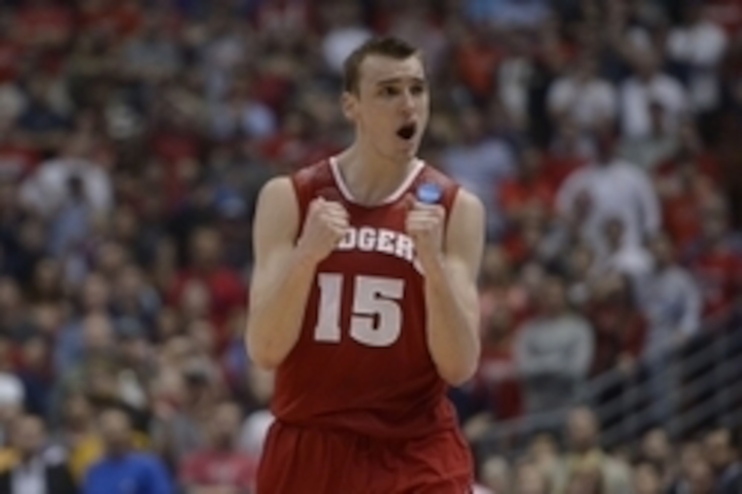 Mar 29, 2014; Anaheim, CA, USA; Wisconsin Badgers forward Sam Dekker (15) celebrates against the Arizona Wildcats during overtime in the finals of the west regional of the 2014 NCAA Mens Basketball Championship tournament at Honda Center. The Badgers defe