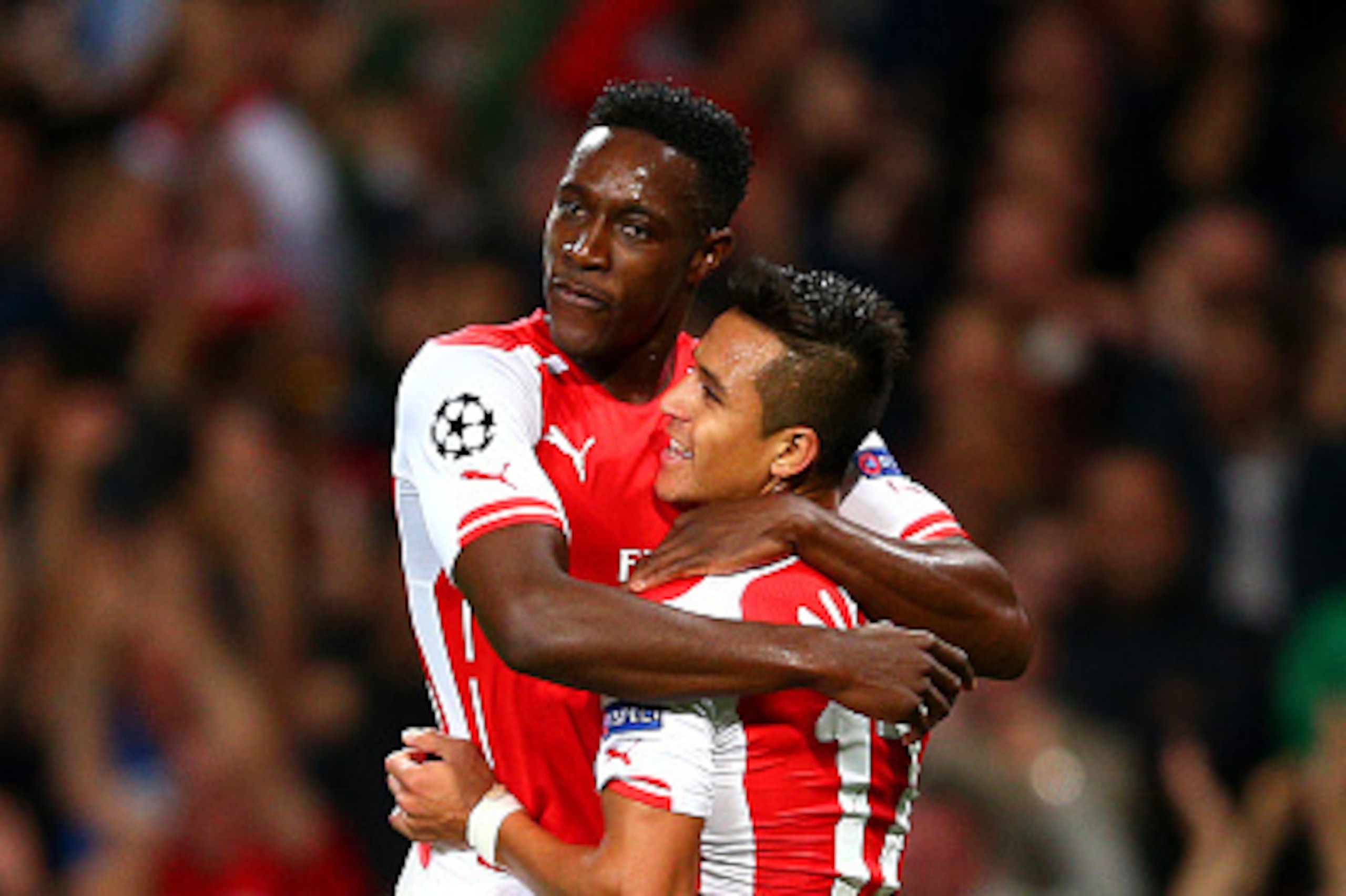 LONDON, ENGLAND - OCTOBER 01:  Danny Welbeck of Arsenal celebrates with team-mate Alexis Sanchez after scoring the opening goal during the UEFA Champions League group D match between Arsenal FC and Galatasaray AS at Emirates Stadium on October 1, 2014 in 