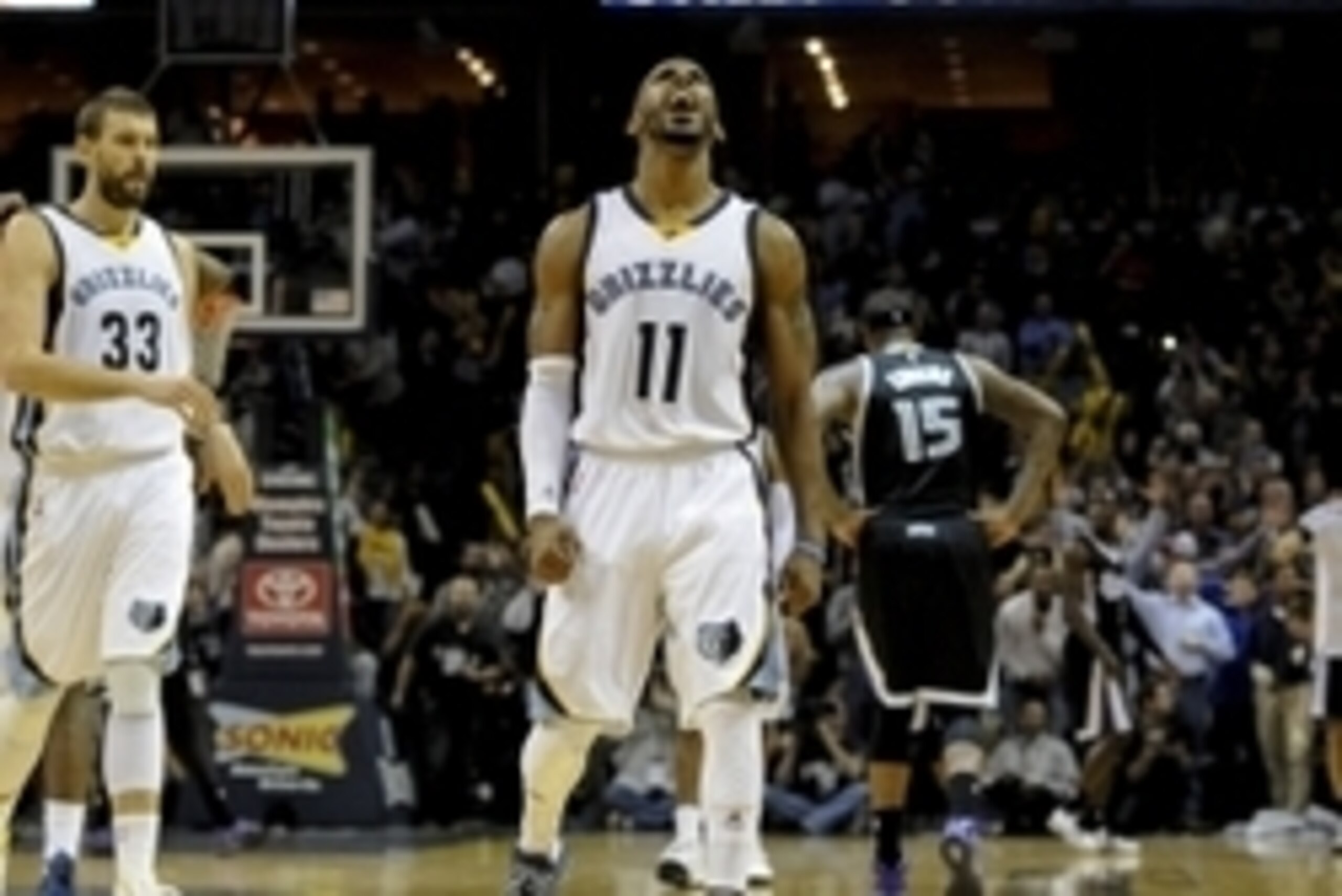 Nov 13, 2014; Memphis, TN, USA; Memphis Grizzlies guard Mike Conley (11) reacts after scoring against the Sacramento Kings  at FedExForum. Memphis Grizzlies beat the Sacramento Kings 111 - 110. Mandatory Credit: Justin Ford-USA TODAY Sports