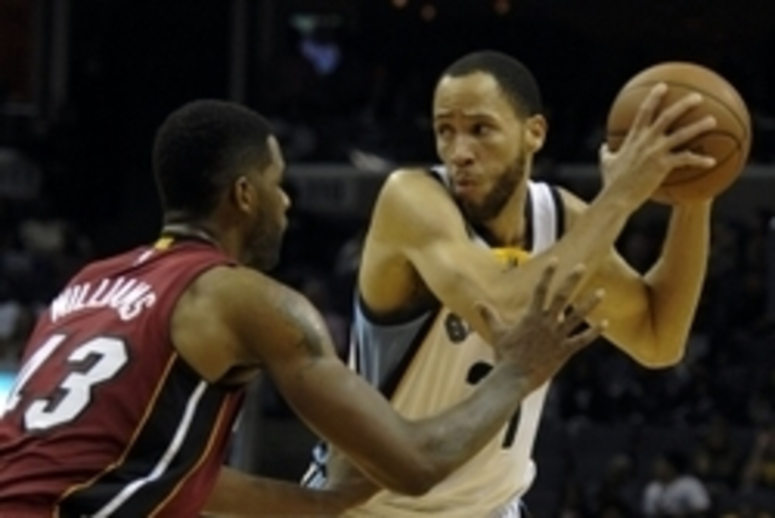 Oct 24, 2014; Memphis, TN, USA; Memphis Grizzlies forward Tayshaun Prince (21) handles the ball against Miami Heat forward Shawne Williams (43) during the game at FedExForum. Mandatory Credit: Justin Ford-USA TODAY Sports