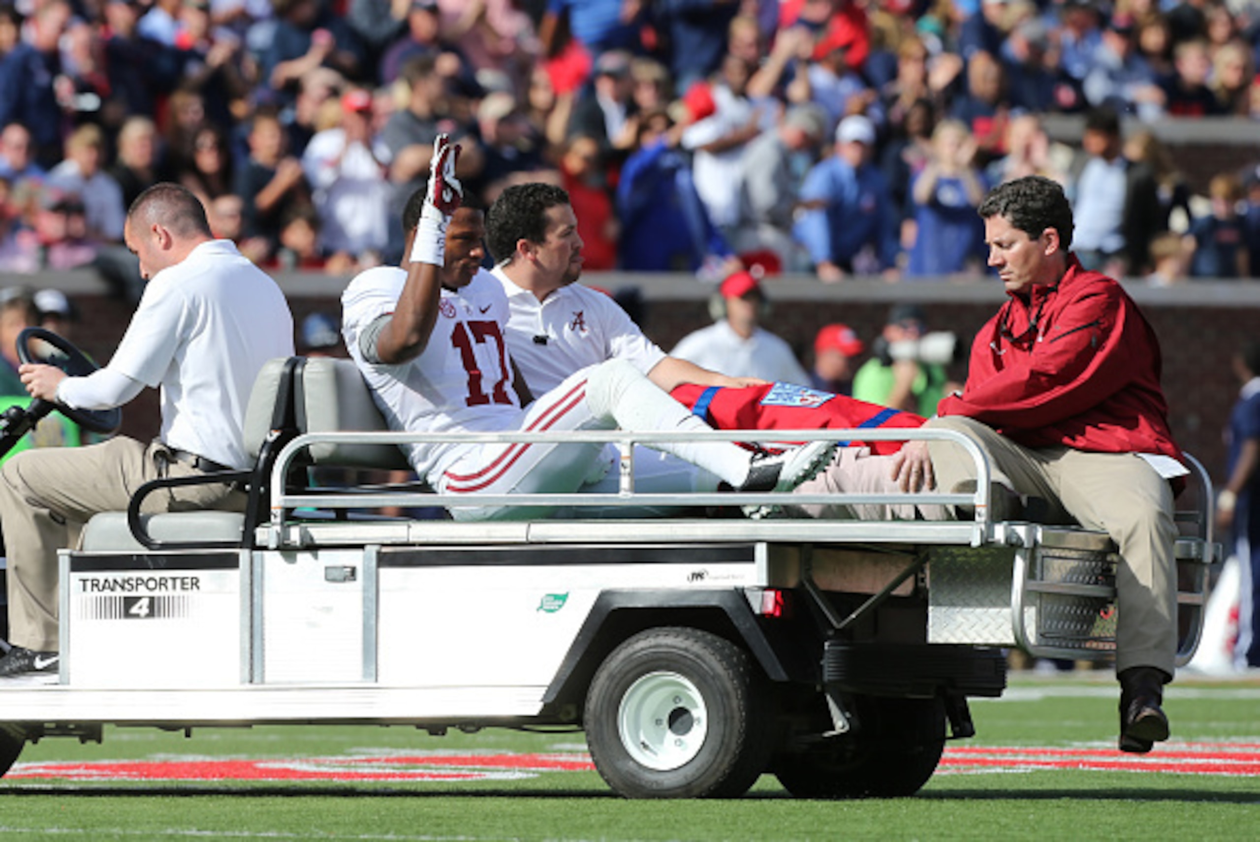 OXFORD, MS - OCTOBER 4: Kenyan Drake #17 of the Alabama Crimson Tide waves to the crowd after being carted off the field with an injury against the Ole Miss Rebels on October 4, 2014 at Vaught-Hemingway Stadium in Oxford, Mississippi. Mississippi beat Ala