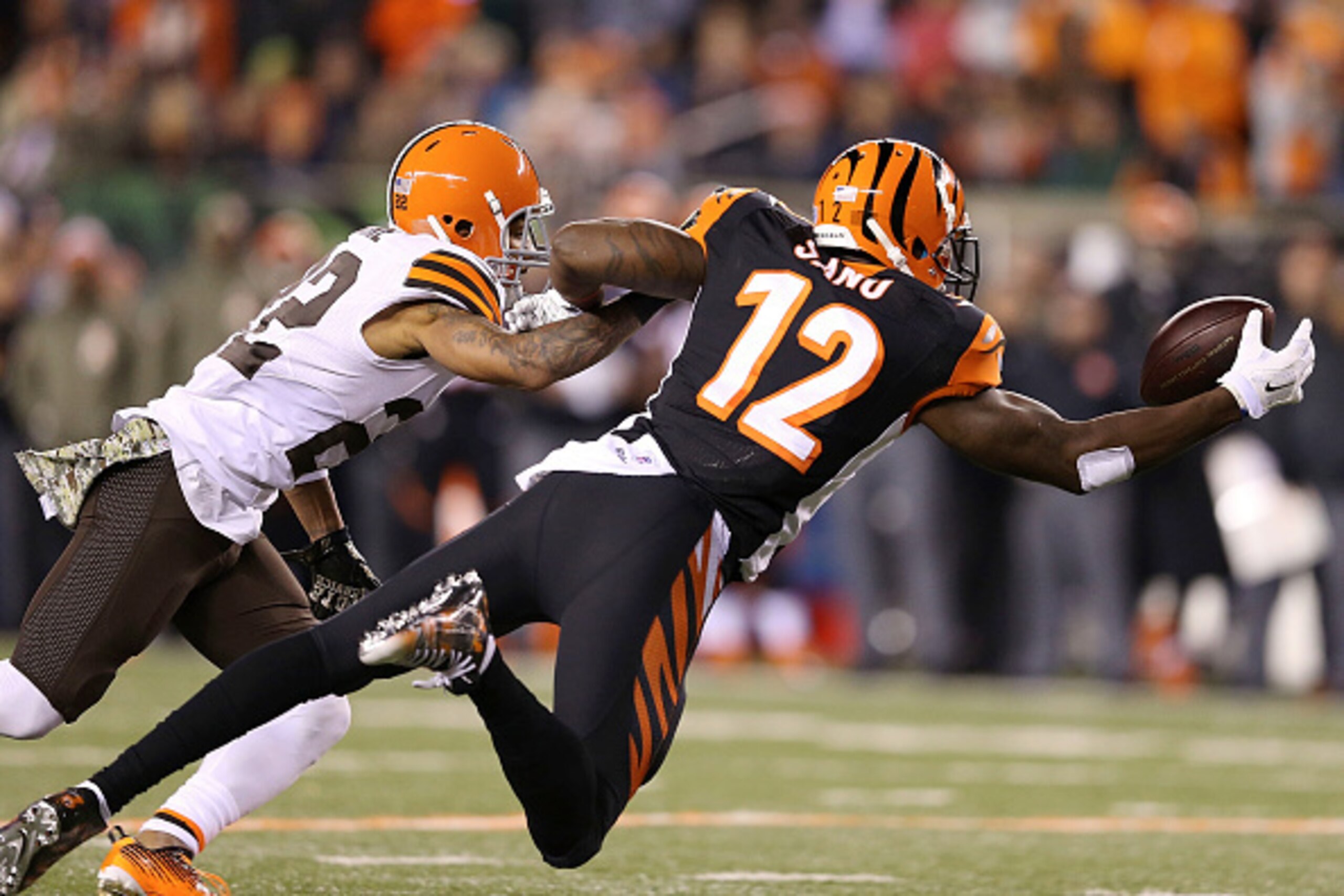 CINCINNATI, OH - NOVEMBER 6 :  Buster Skrine #22 of the Cleveland Browns defends as Mohamed Sanu #12 of the Cincinnati Bengals dives but is unable to make the catch during the first quarter at Paul Brown Stadium on November 6, 2014 in Cincinnati, Ohio. (P