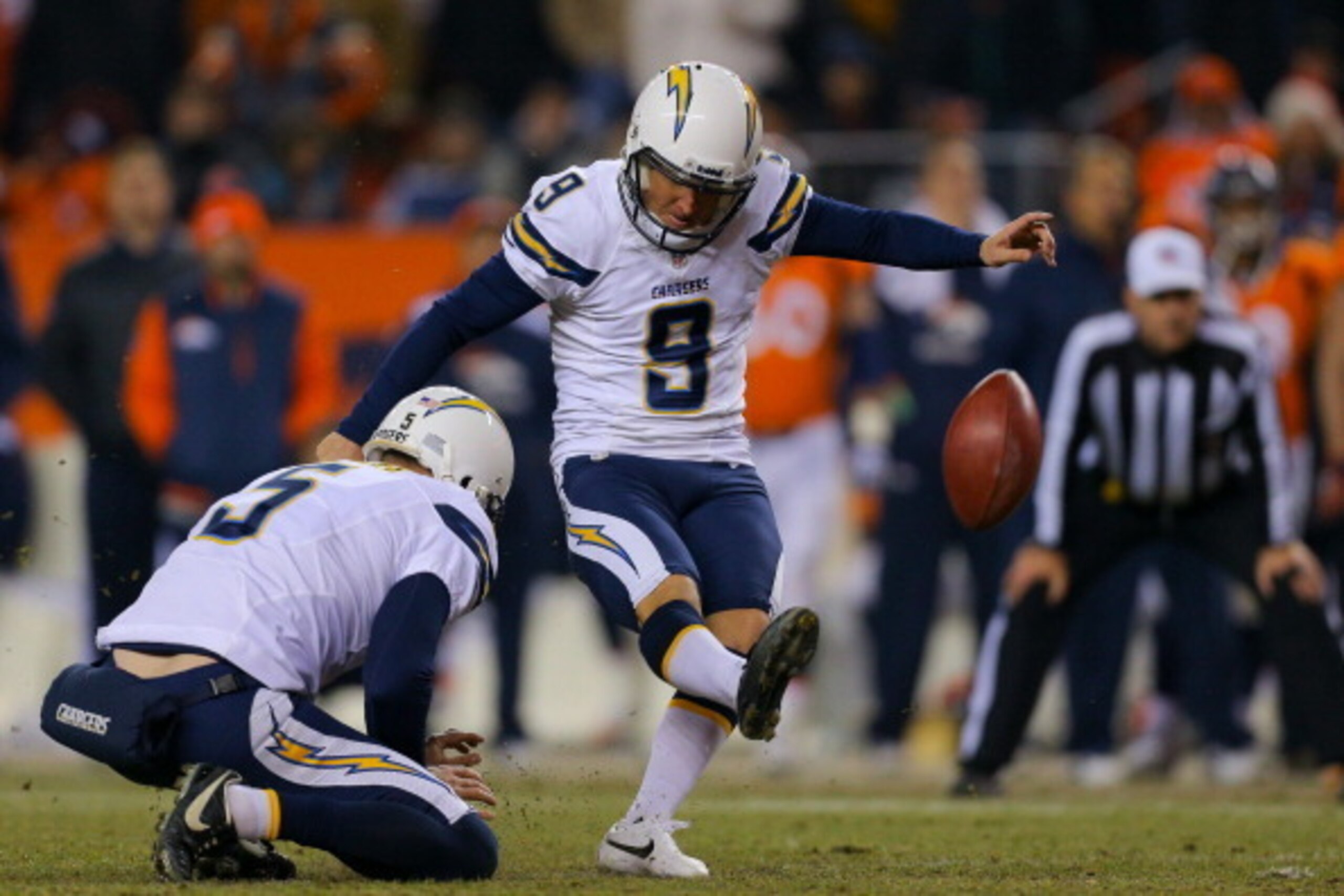 DENVER, CO - DECEMBER 12:  Place kicker Nick Novak #9 of the San Diego Chargers kicks a 35-yard field goal on a hold by Mike Scifres #5 during the fourth quarter against the Denver Broncos at Sports Authority Field Field at Mile High on December 12, 2013 