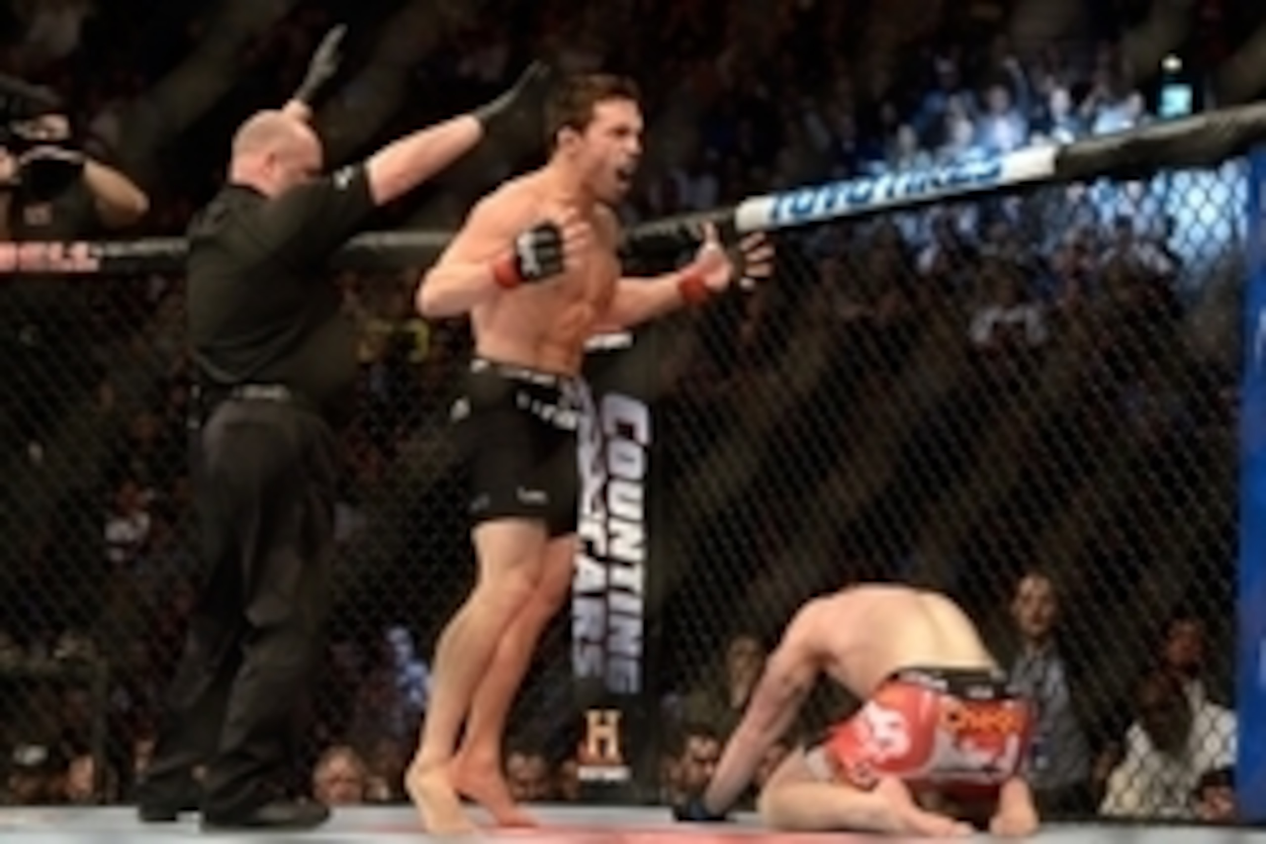 Mar 16, 2013; Montreal, Quebec, CAN;  Jake Ellenberger (red) celebrates after defeating Nate Marquardt (blue) in their main card bout at UFC 158 at the Bell Centre. Mandatory Credit: Eric Bolte-USA TODAY Sports