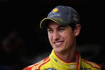 MARTINSVILLE, VA - OCTOBER 24:  Joey Logano, driver of the #22 Shell Pennzoil Ford, stands in the garage area during practice for the NASCAR Sprint Cup Series Goody's Headache Relief Shot 500 at Martinsville Speedway on October 24, 2014 in Martinsville, V