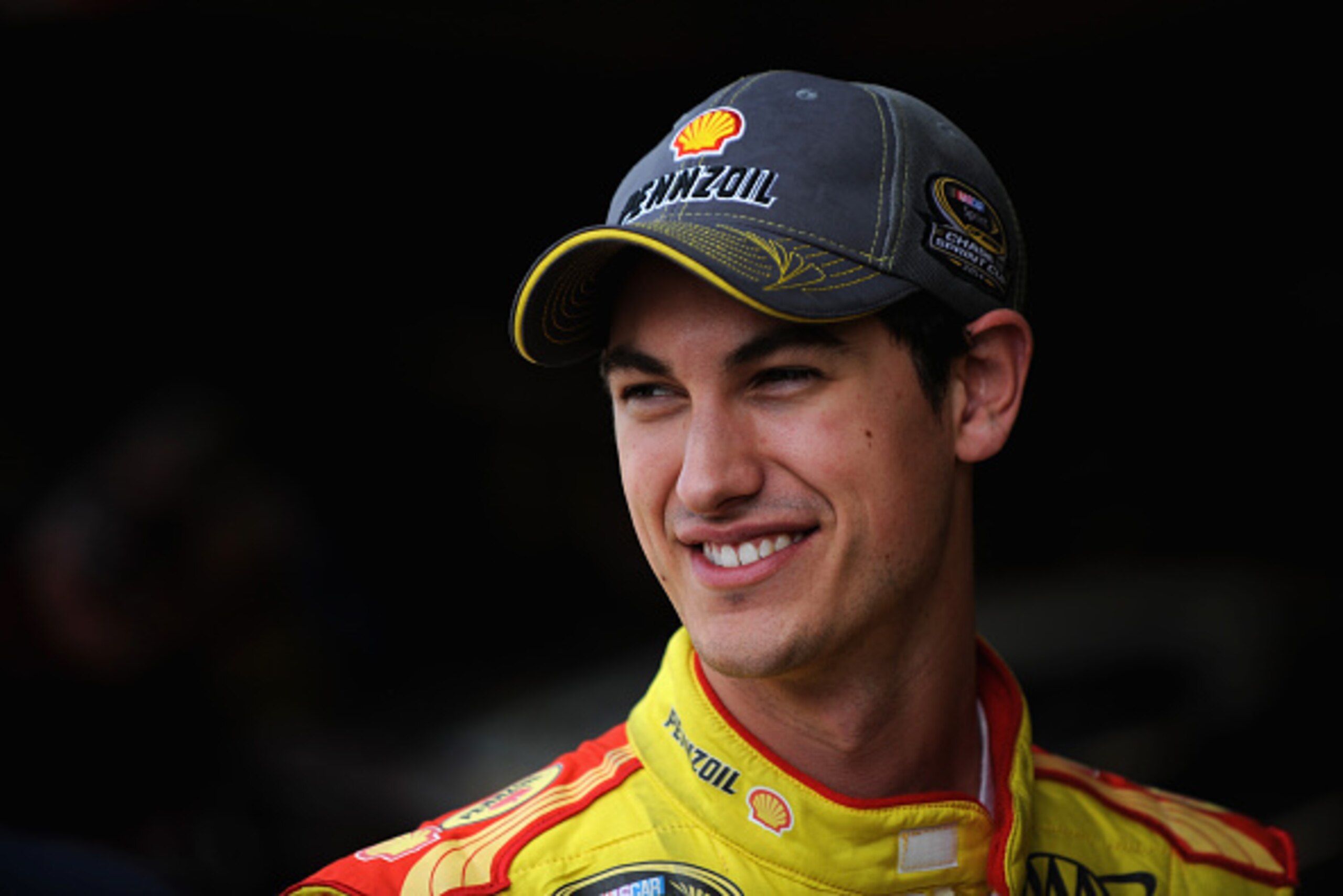 MARTINSVILLE, VA - OCTOBER 24:  Joey Logano, driver of the #22 Shell Pennzoil Ford, stands in the garage area during practice for the NASCAR Sprint Cup Series Goody's Headache Relief Shot 500 at Martinsville Speedway on October 24, 2014 in Martinsville, V