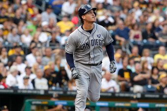 PITTSBURGH, PA - AUGUST 9:  Yasmani Grandal #8 of the San Diego Padres flies out to center field against the Pittsburgh Pirates during the first inning of their game on August 9, 2014 at PNC Park in Pittsburgh, Pennsylvania.  The Padres defeated the Pirat