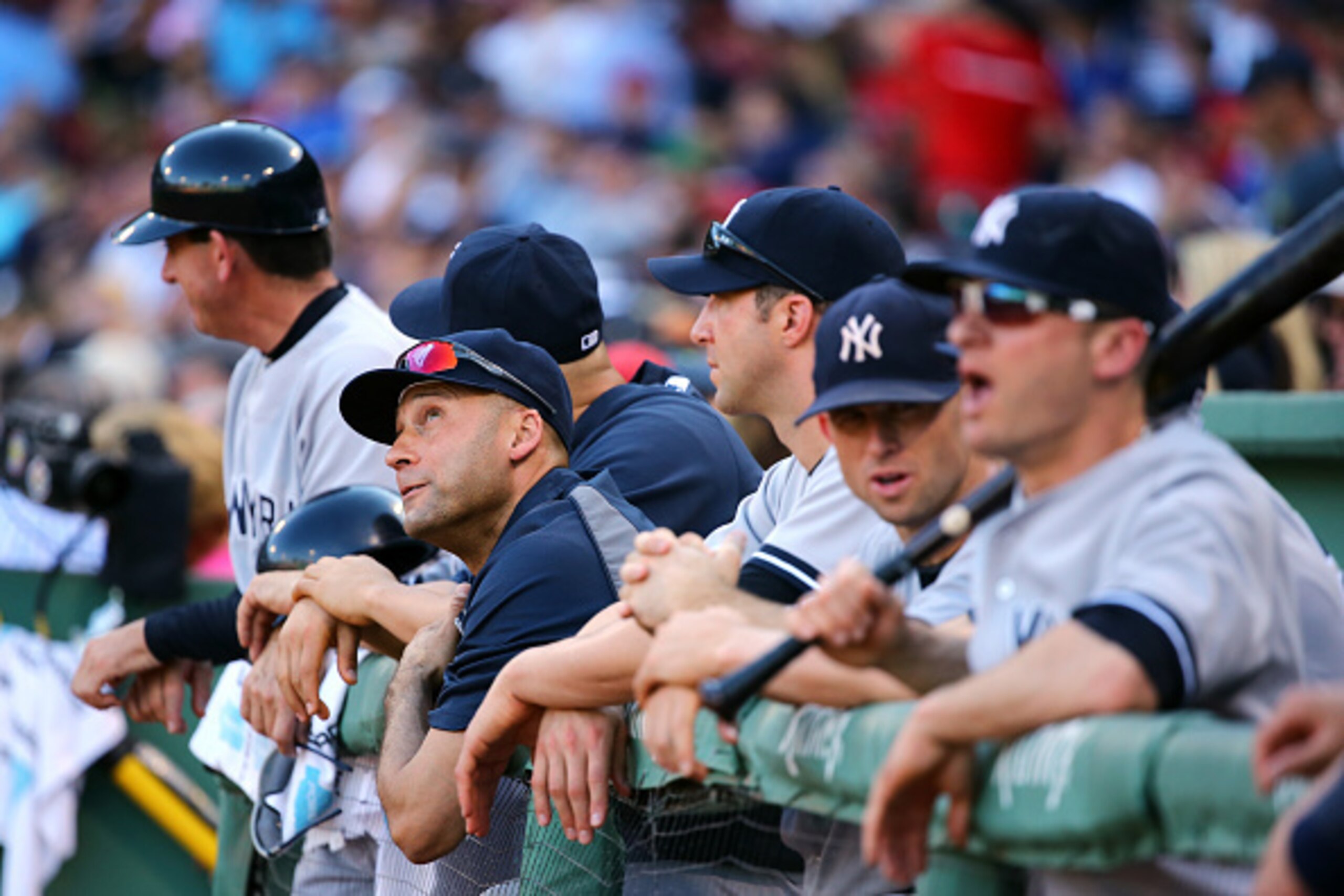 BOSTON, MA - SEPTEMBER 28:  Derek Jeter #2 of the New York Yankees looks on from the dugout against the Boston Red Sox during the last game of the season at Fenway Park on September 28, 2014 in Boston, Massachusetts.  (Photo by Al Bello/Getty Images)
